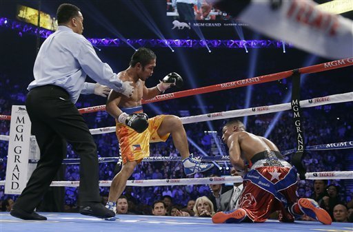 No, he isn't kicking him, but Darleys Perez did knock Yuriorkis Gamboa down.