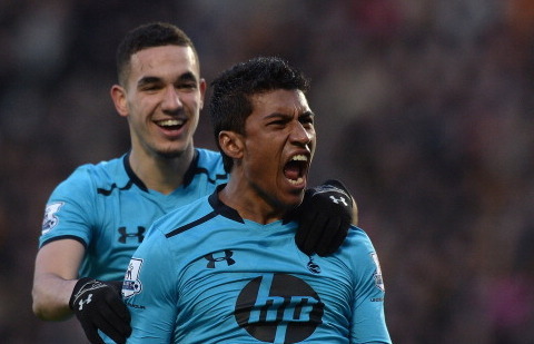 Bentaleb celebrates with Paulinho after the Brazilian's goal.