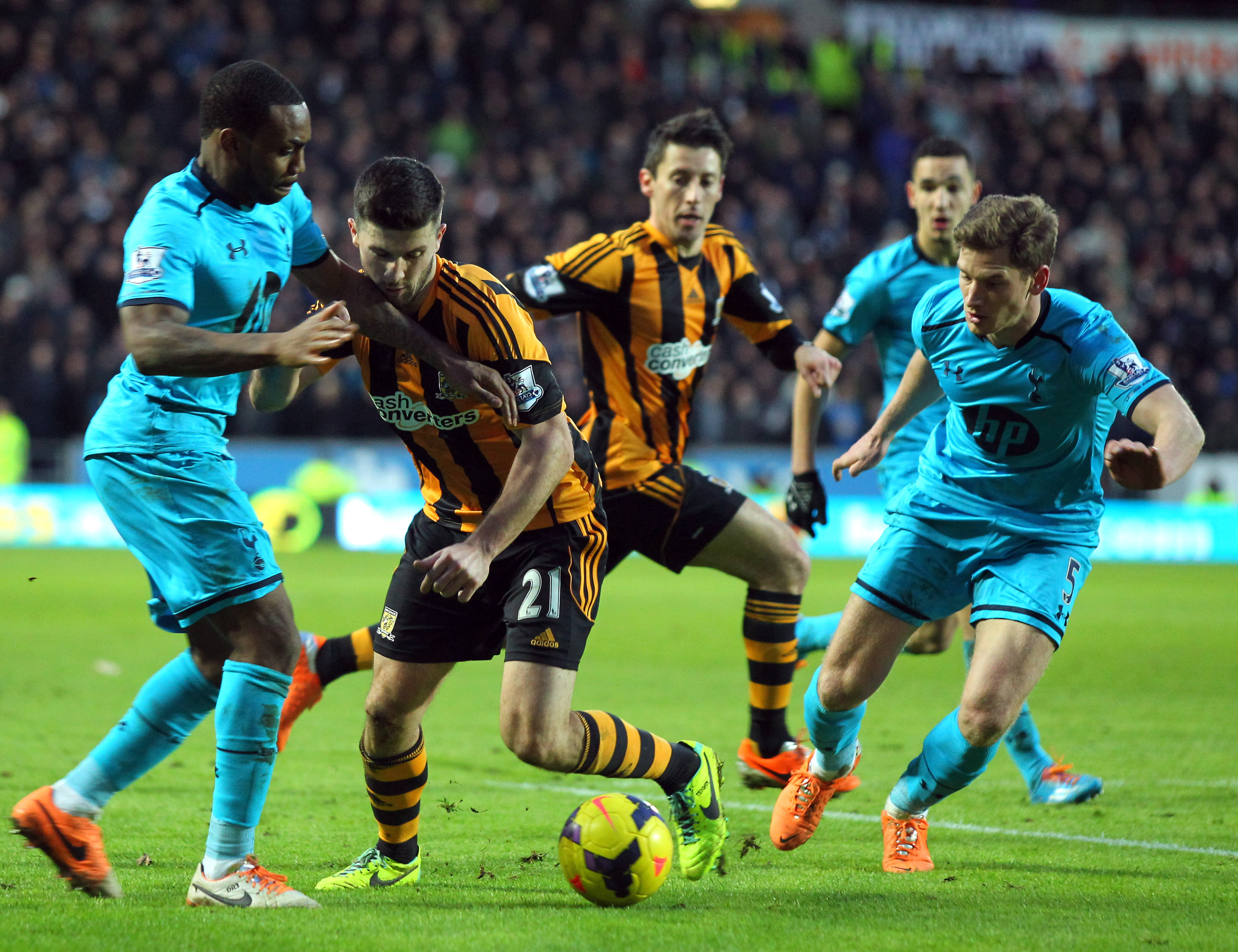 Jan Vertonghen and Danny Rose attempt to tackle Shane Long.
