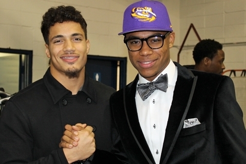 5-star WR Malachi Dupre (right) celebrates with current LSU linebacker Duke Riley (left) after signing with the Tigers on national signing day.