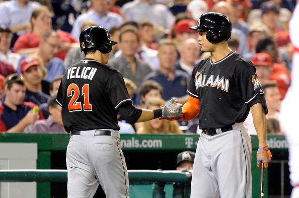 The success of the Marlins offense will hinge on the progress of Christian Yelich, left, and Giancarlo Stanton's power.
