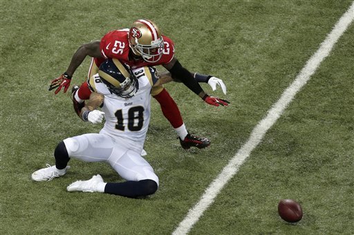 Tarell Brown breaks up this pass against the Rams.