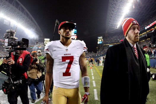 SEATTLE, WA - JANUARY 19:  Quarterback Colin Kaepernick #7 of the San Francisco 49ers walks off the field after losing to the Seattle Seahawks 23-17 during the 2014 NFC Championship at CenturyLink Field on January 19, 2014 in Seattle, Washington.  (Photo 