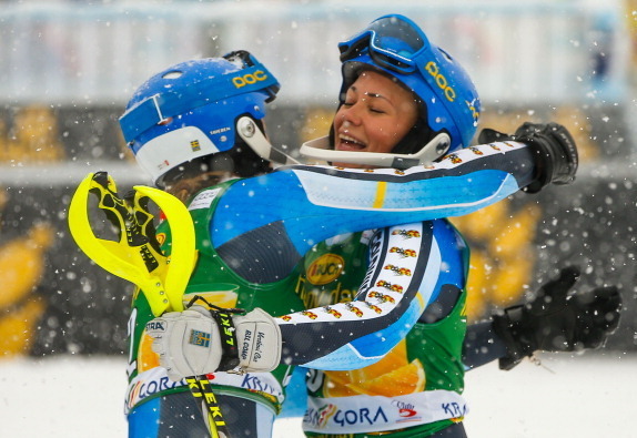 Frida Hansdotter is congratulated on her slalom success in Kranjska Gora by a Swedish teammate.