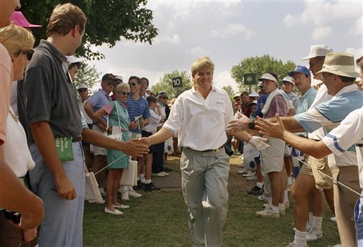 The boyish face of John Daly in 1991 as he interacted with fans.