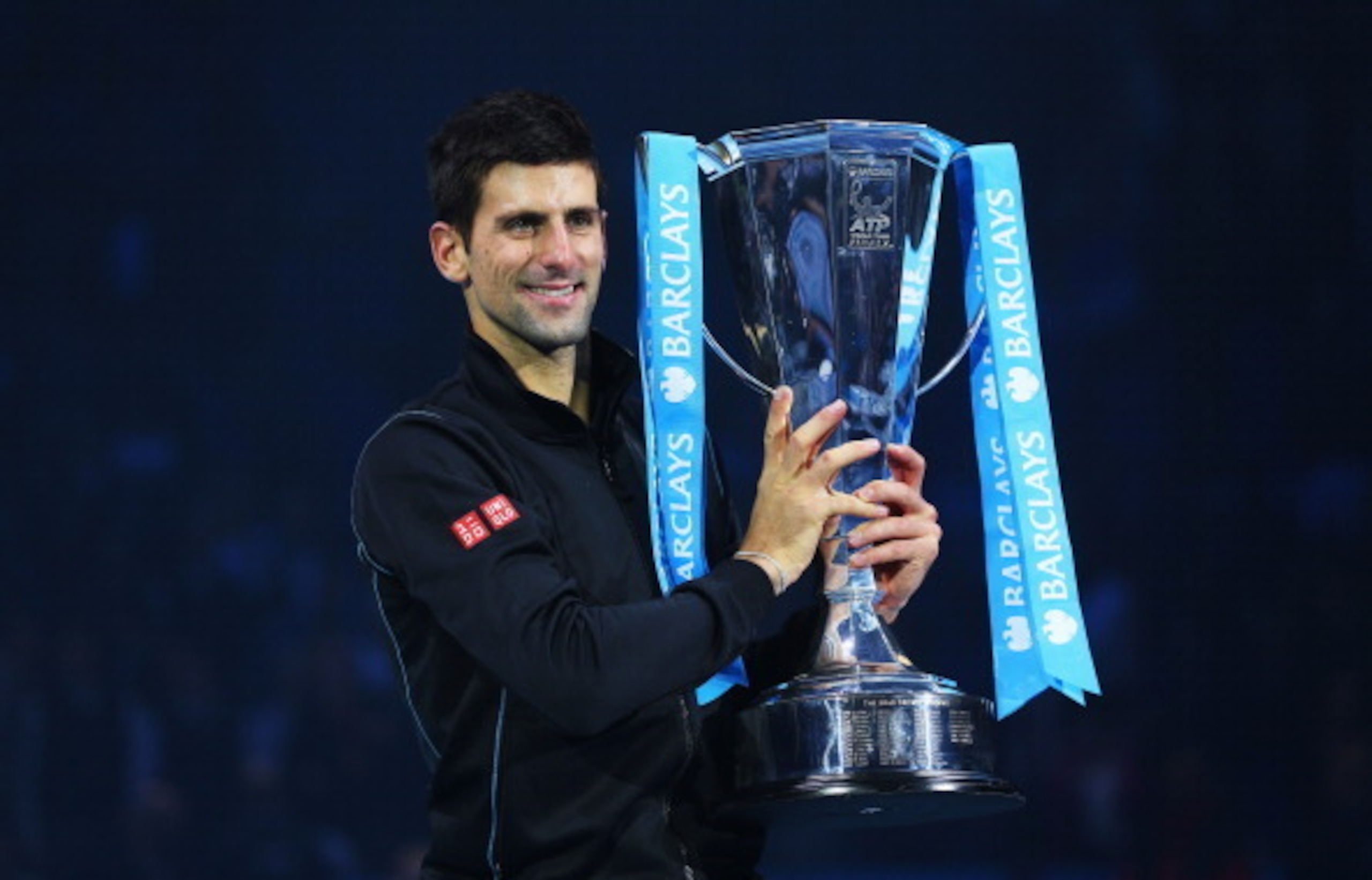 Novak Djokovic holds trophy at 2013 ATP World Tour Finals. Novak Djokovic holds trophy at 2013 ATP World Tour Finals.