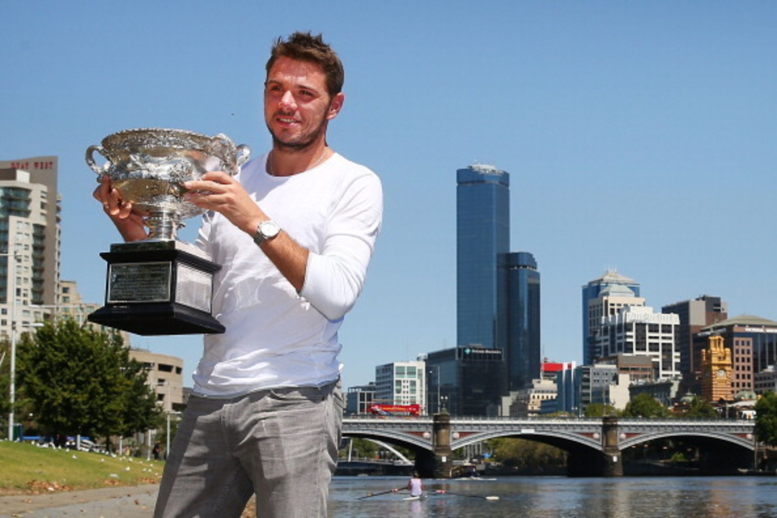 Stanislas Wawrinka poses with trophy after winning 2014 Australian Open. Stanislas Wawrinka poses with trophy after winning 2014 Australian Open.