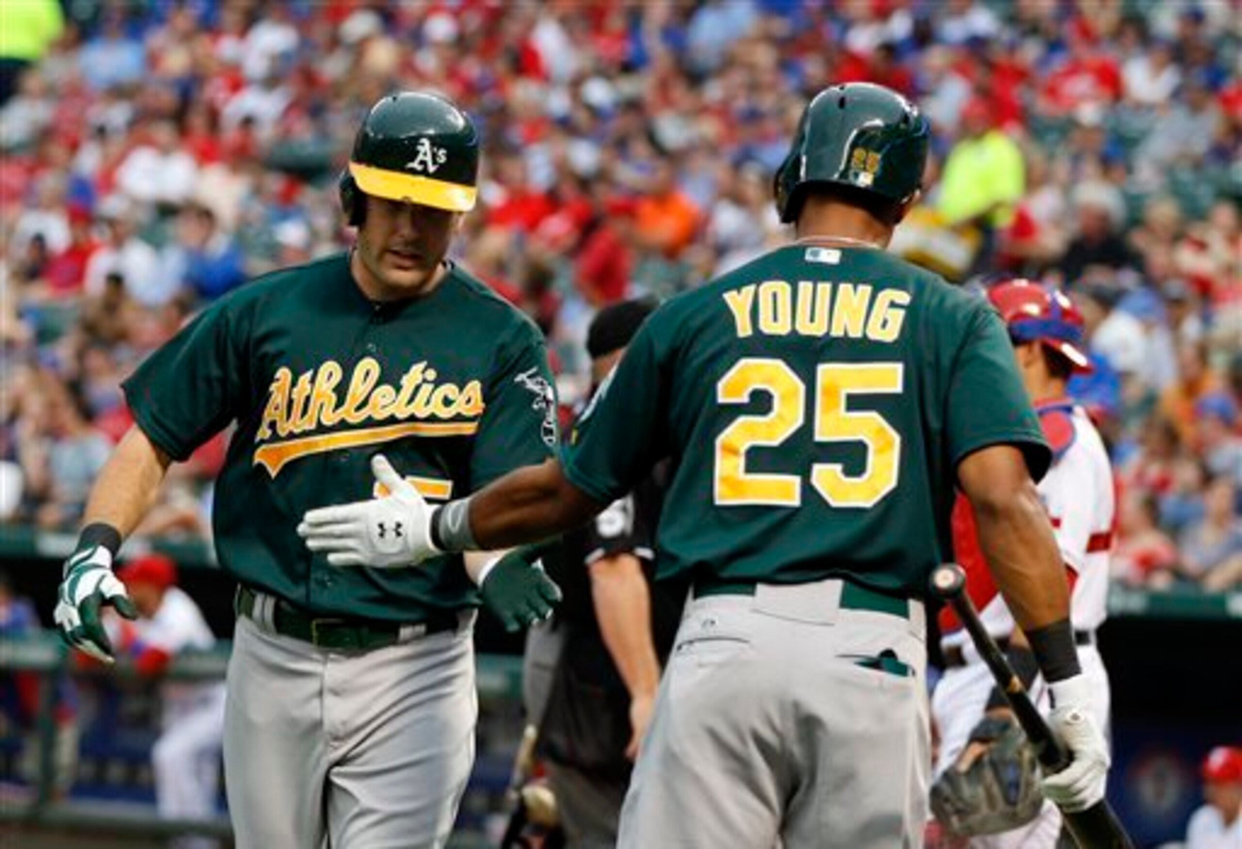 Seth Smith is met by Chris Young, both of whom will play elsewhere in 2014. Seth Smith is met by Chris Young, both of whom will play elsewhere in 2014.