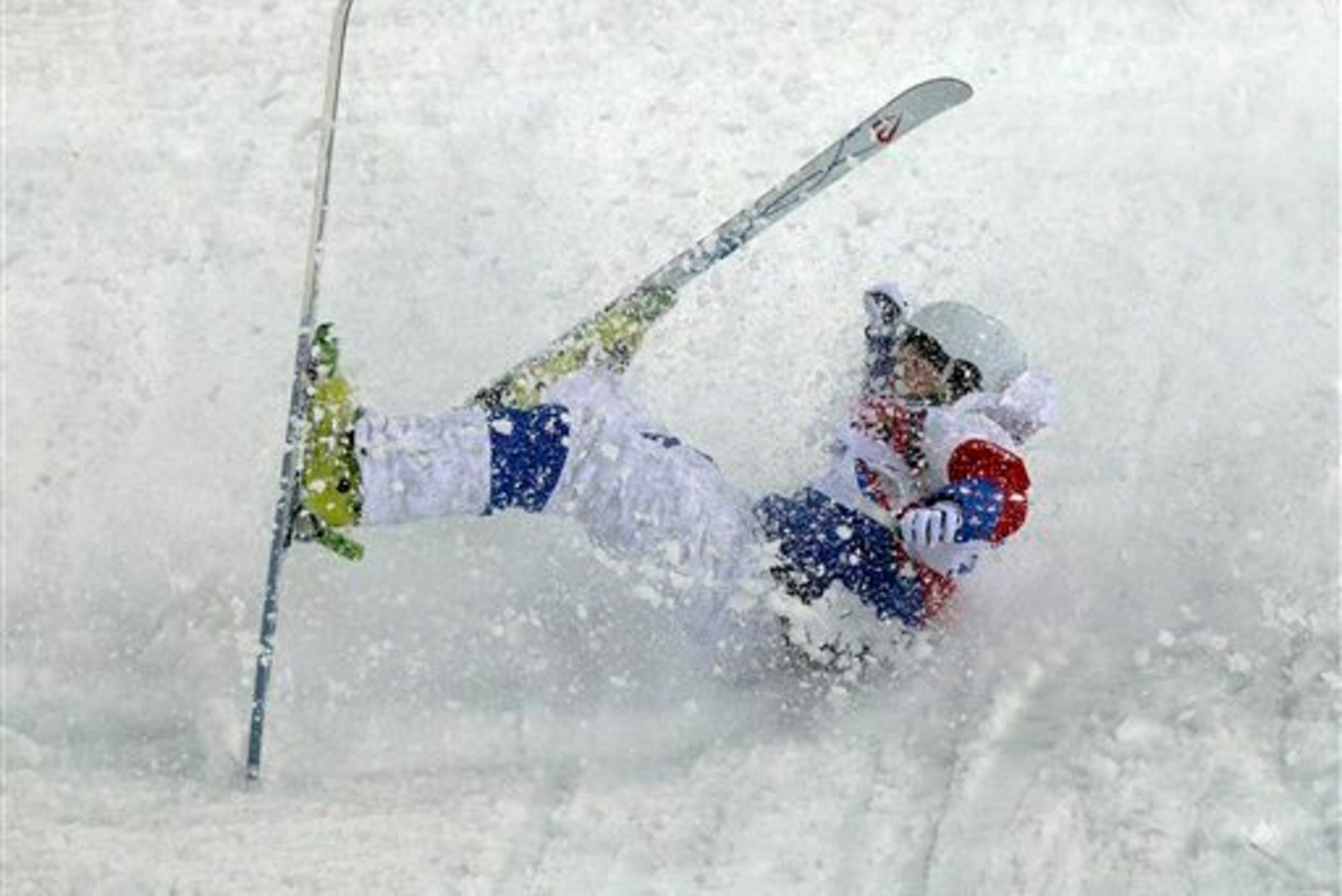 Russian moguls skier Sergey Volkov bites the snow during one of his runs.