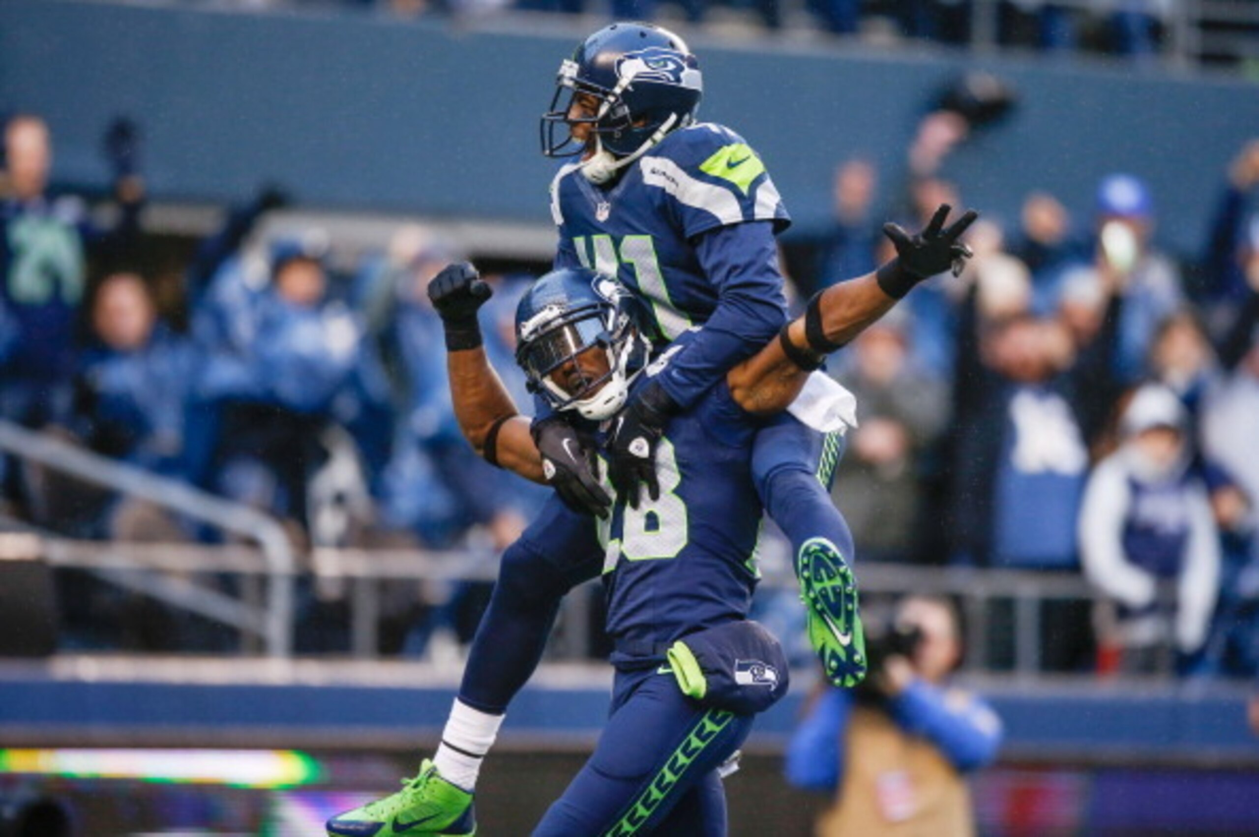 SEATTLE, WA - NOVEMBER 17:  Cornerback Walter Thurmond #28 of the Seattle Seahawks is congratulated by defensive back Byron Maxwell #41 after returning an interception for a touchdown against the Minnesota Vikings at CenturyLink Field on November 17, 2013