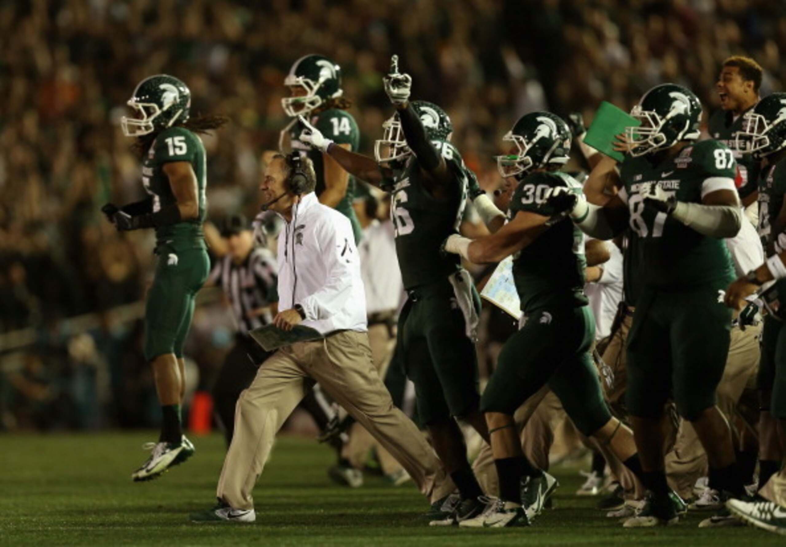 Dantonio and the Spartans celebrate their 2014 Rose Bowl victory over Stanford.