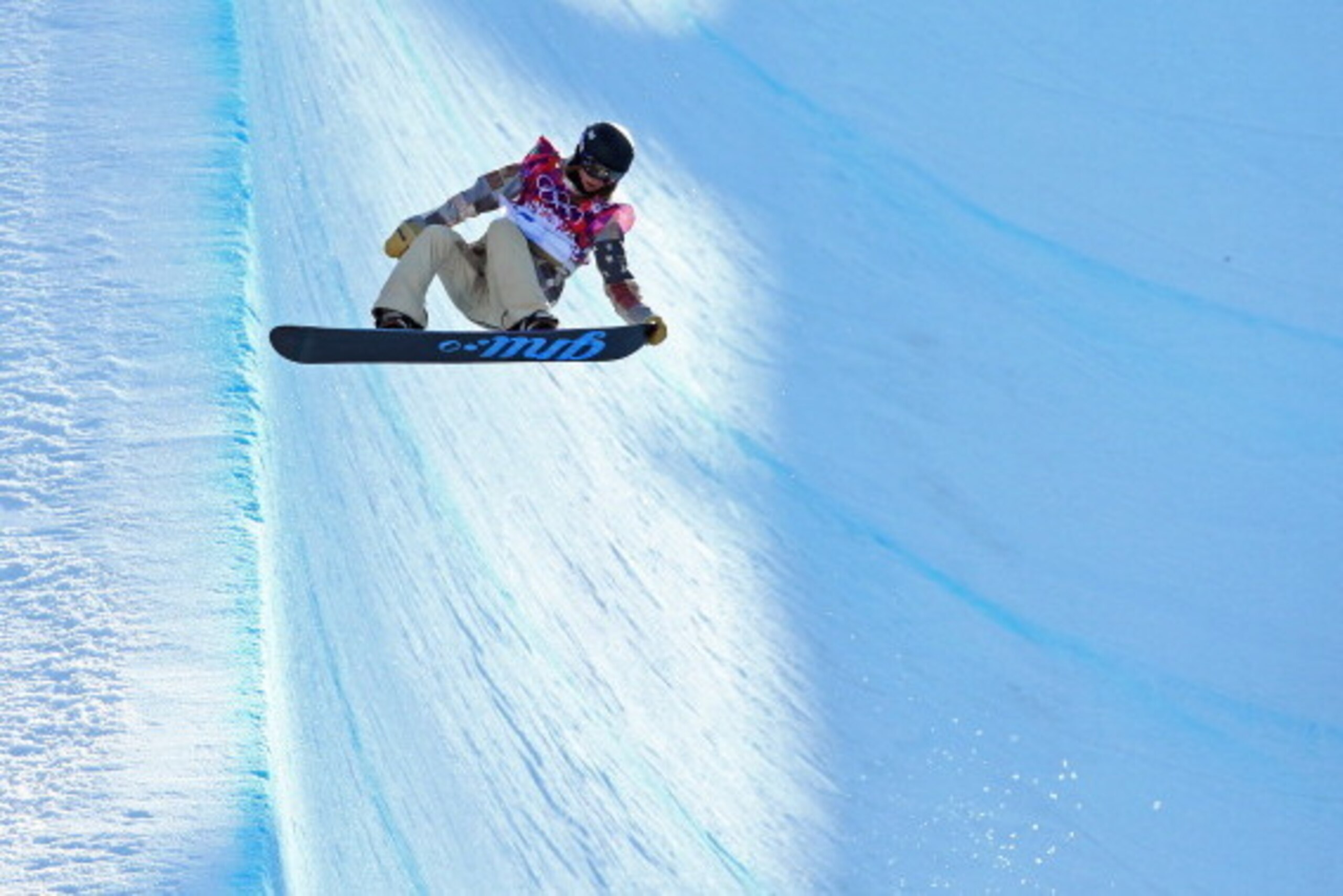 Kaitlyn Farrington hangs in the air over the snowboard halfpipe. Farrington won the gold medal in the event.