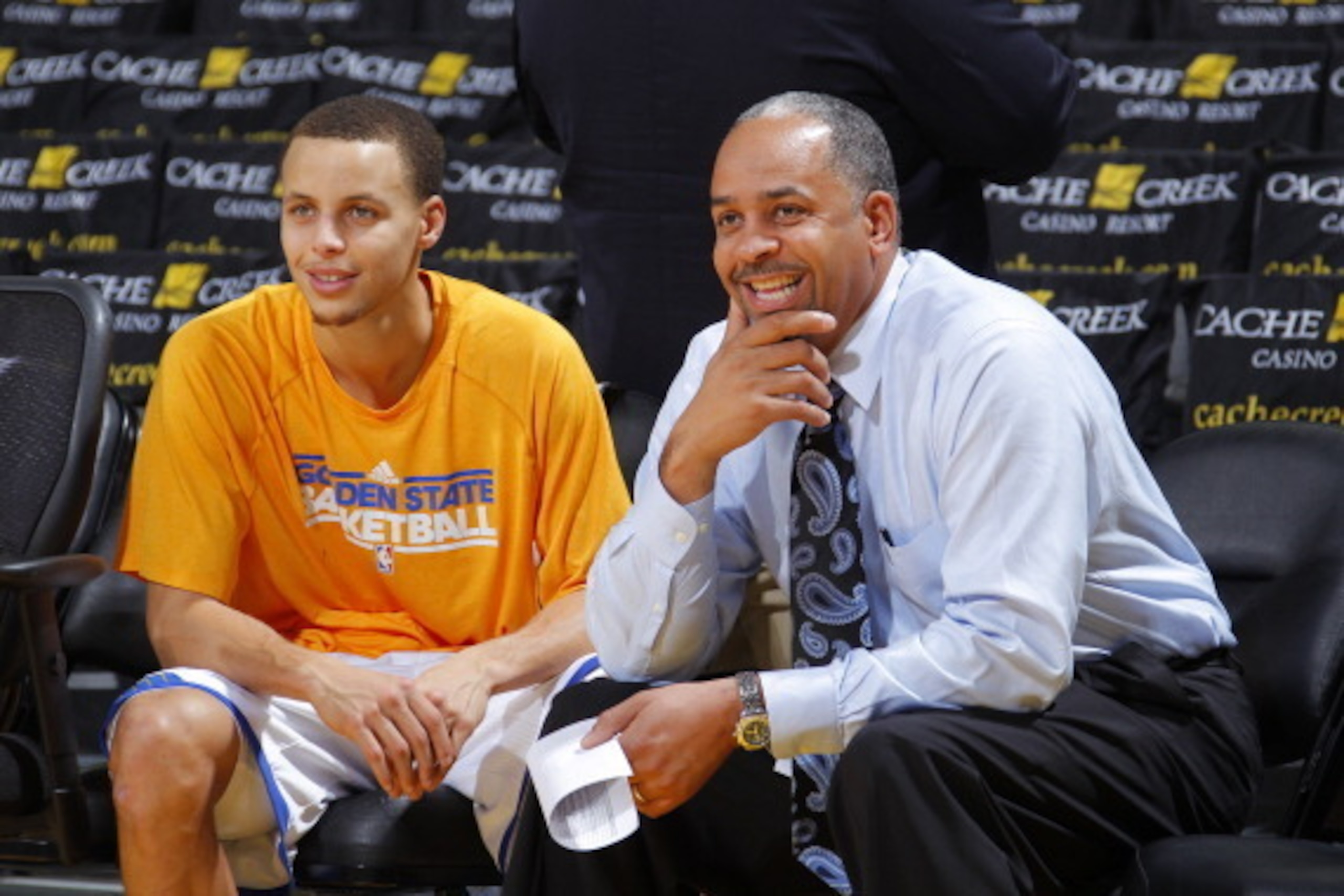 OAKLAND, CA - JANUARY 28: Stephen Curry #30 of the Golden State Warriors chats with his father Dell Curry, the commentator for the Charlotte Bobcats, on January 28, 2011 at Oracle Arena in Oakland, California. NOTE TO USER: User expressly acknowledges and