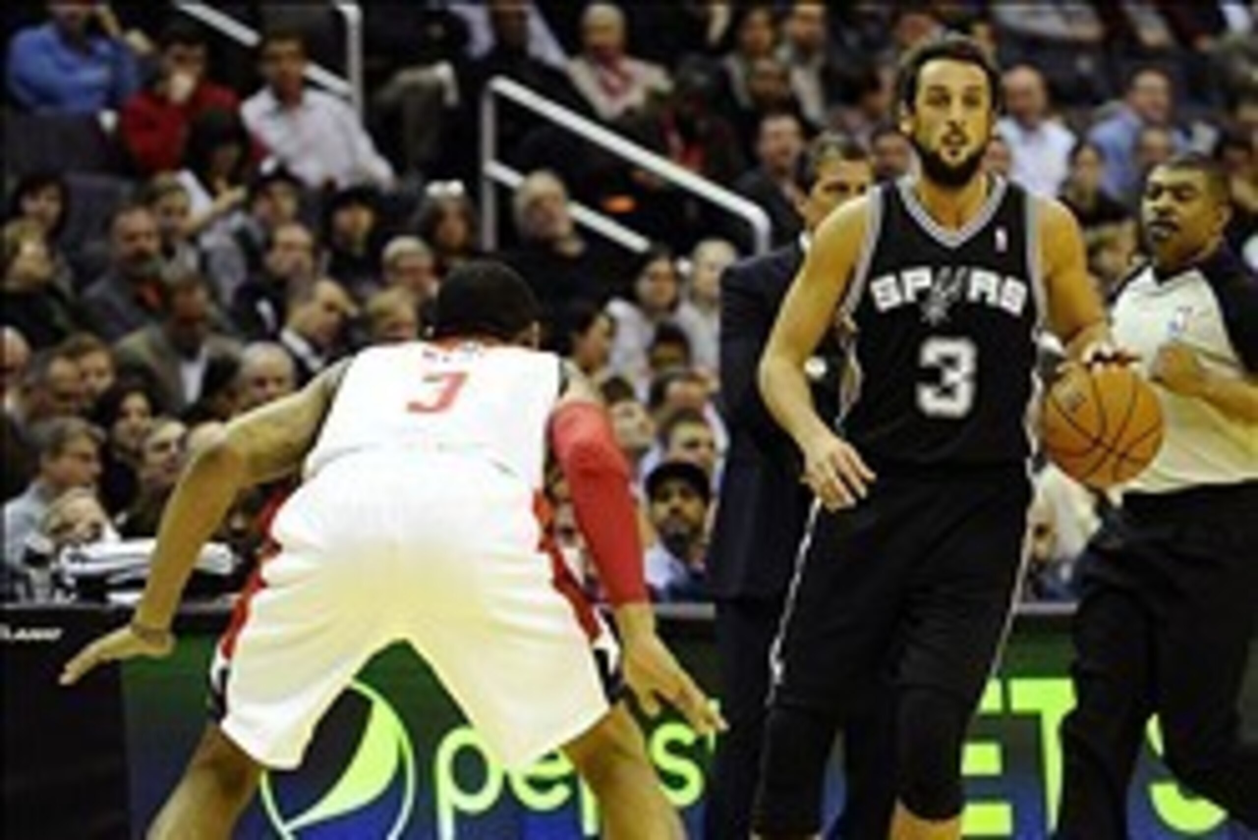 Feb 5, 2014; Washington, DC, USA; San Antonio Spurs shooting guard Marco Belinelli (3) dribbles the ball as Washington Wizards shooting guard Bradley Beal (3) defends during the first half at Verizon Center. Mandatory Credit: Brad Mills-USA TODAY Sports