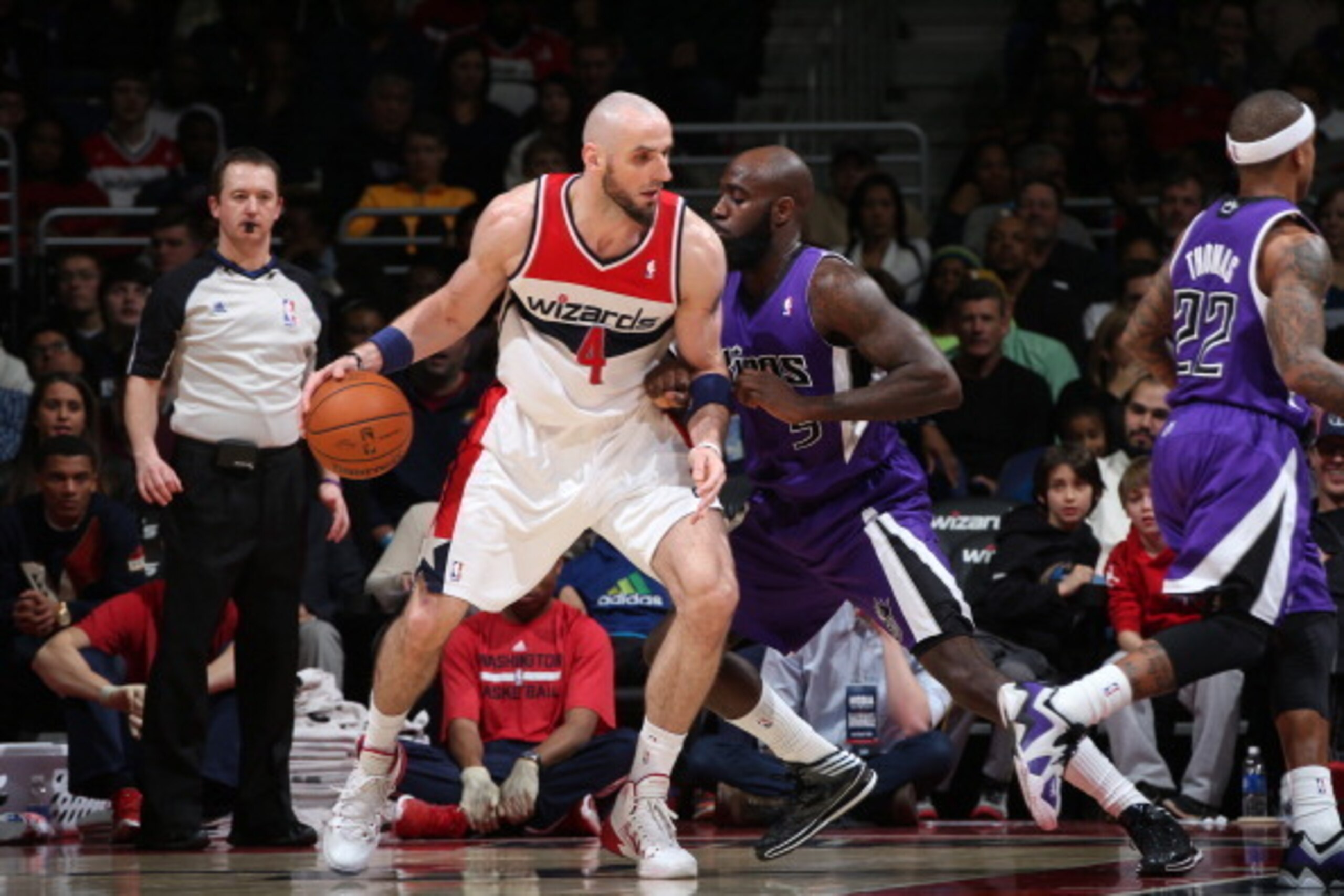 WASHINGTON, DC - FEBRUARY 9: Marcin Gortat #4 of the Washington Wizards drives against Quincy Acy #5 of the Sacramento Kings at the Verizon Center on February 9, 2014 in Washington, DC. NOTE TO USER: User expressly acknowledges and agrees that, by downloa