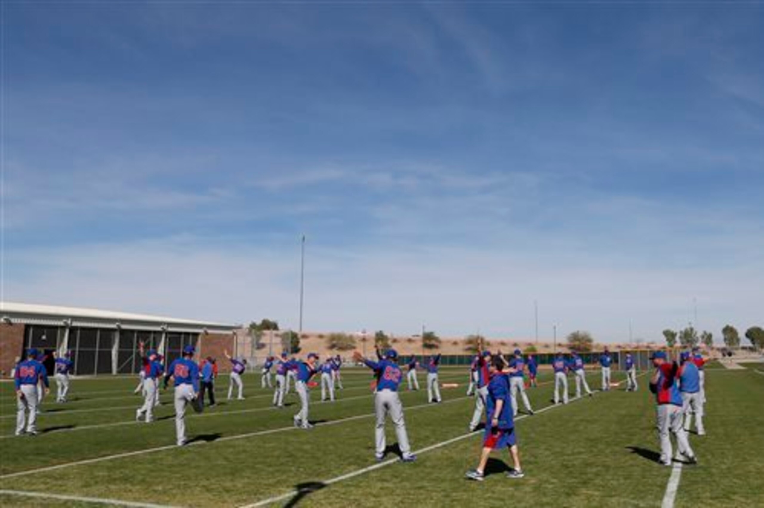 Cubs pitchers and catchers warm up in Mesa, AZ.