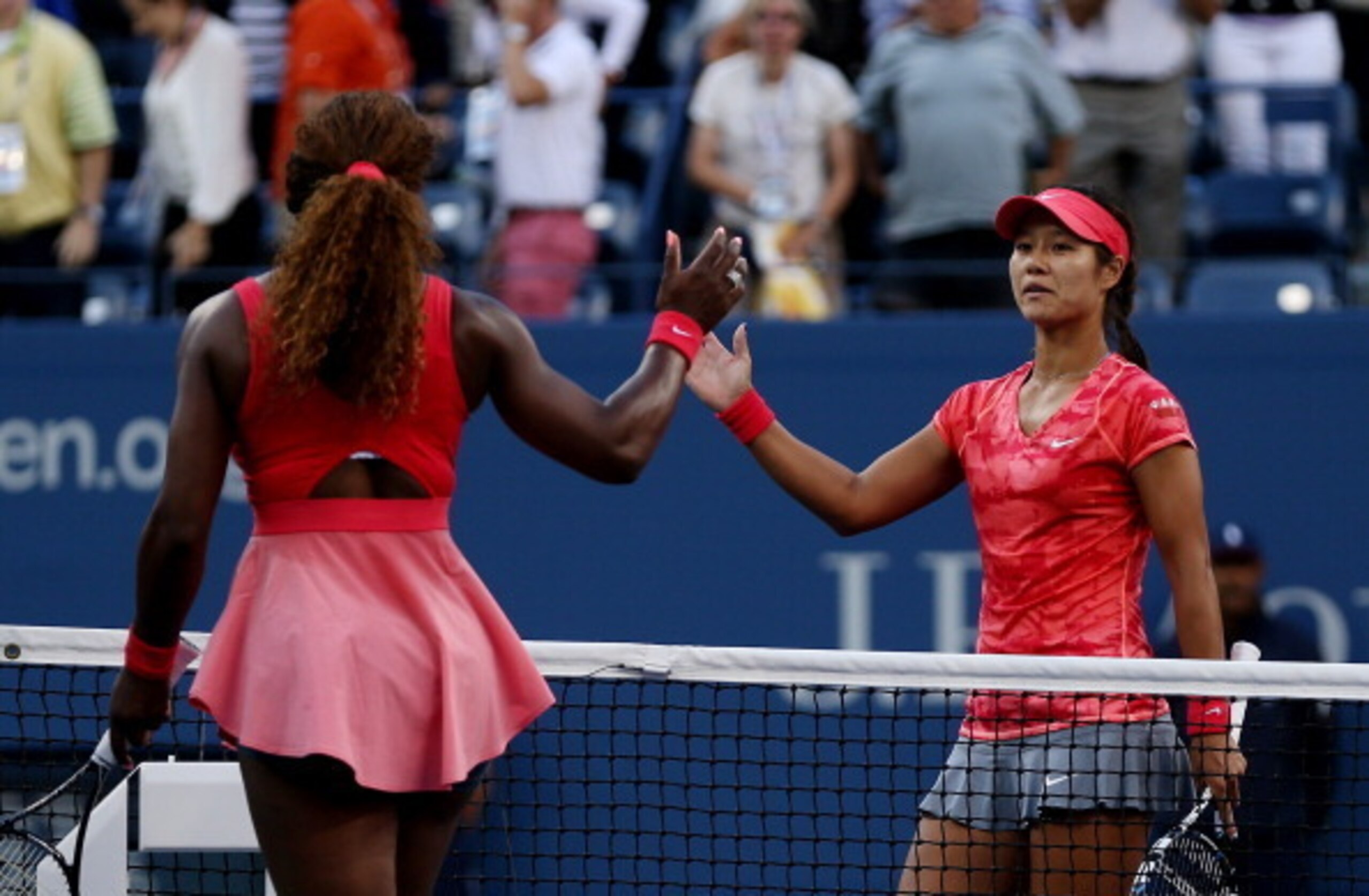 Serena Williams and Li Na prepare to shake hands after semifinal match at 2013 U.S. Open.