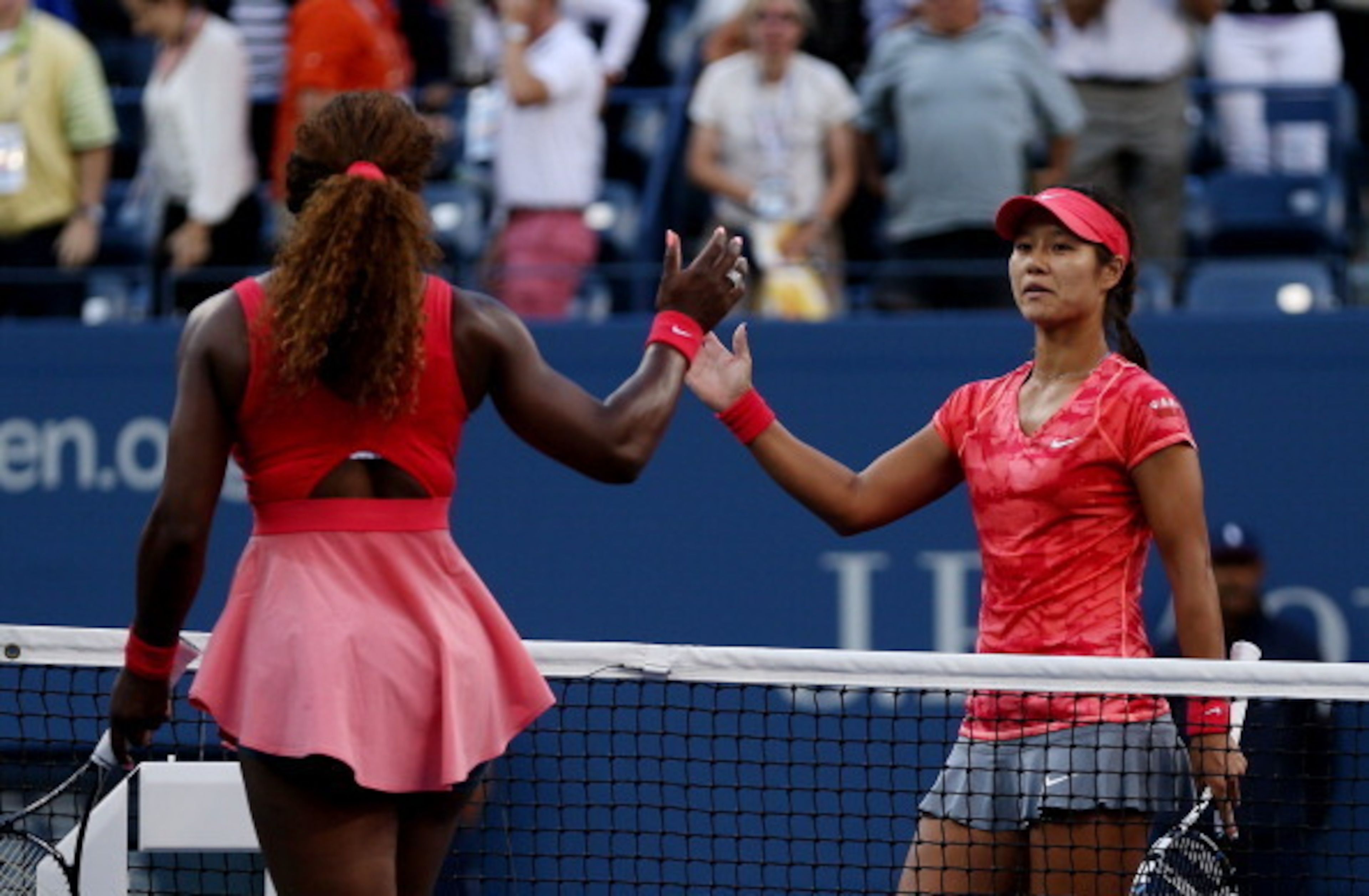 Serena Williams and Li Na prepare to shake hands after semifinal match at 2013 U.S. Open.