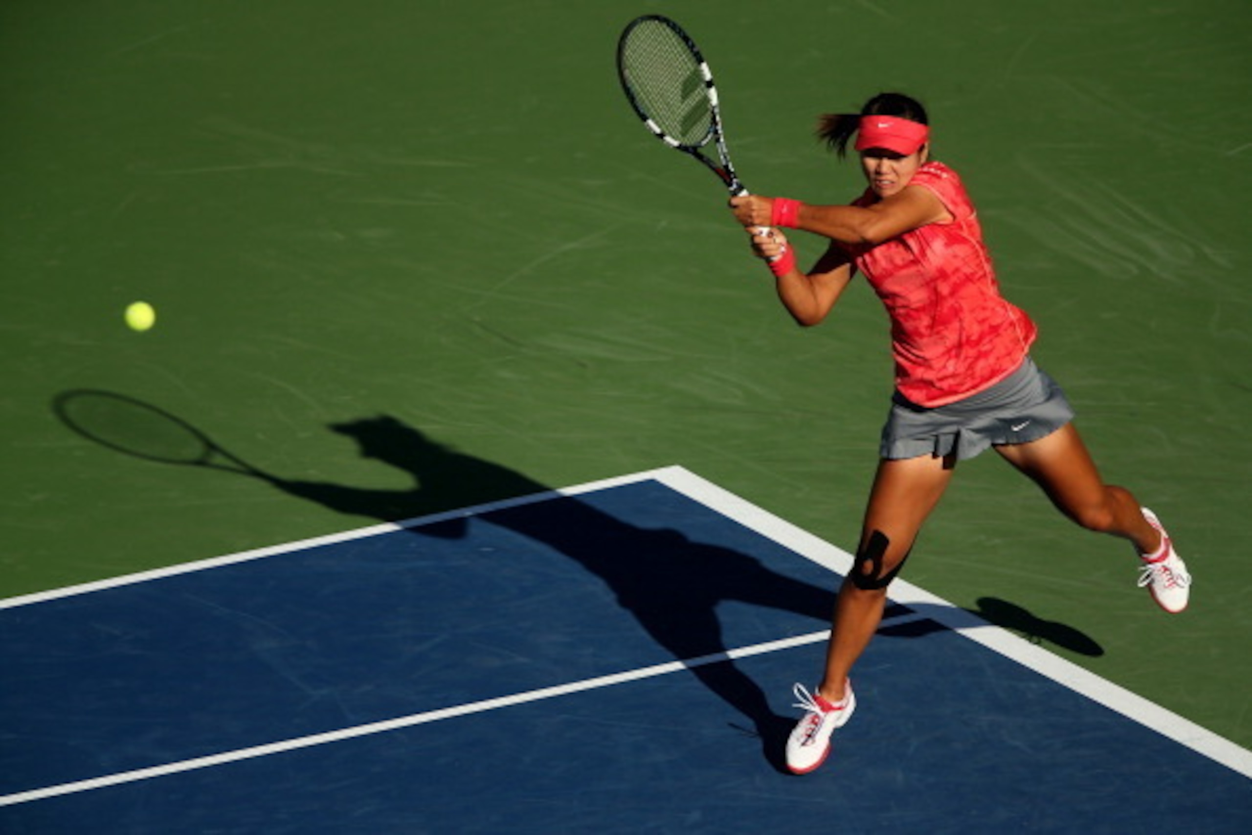 NEW YORK, NY - SEPTEMBER 06:  Na Li of China plays a backhand during her women's singles semifinal match against Serena Williams of United States of America on Day Twelve of the 2013 US Open at USTA Billie Jean King National Tennis Center on September 6, 