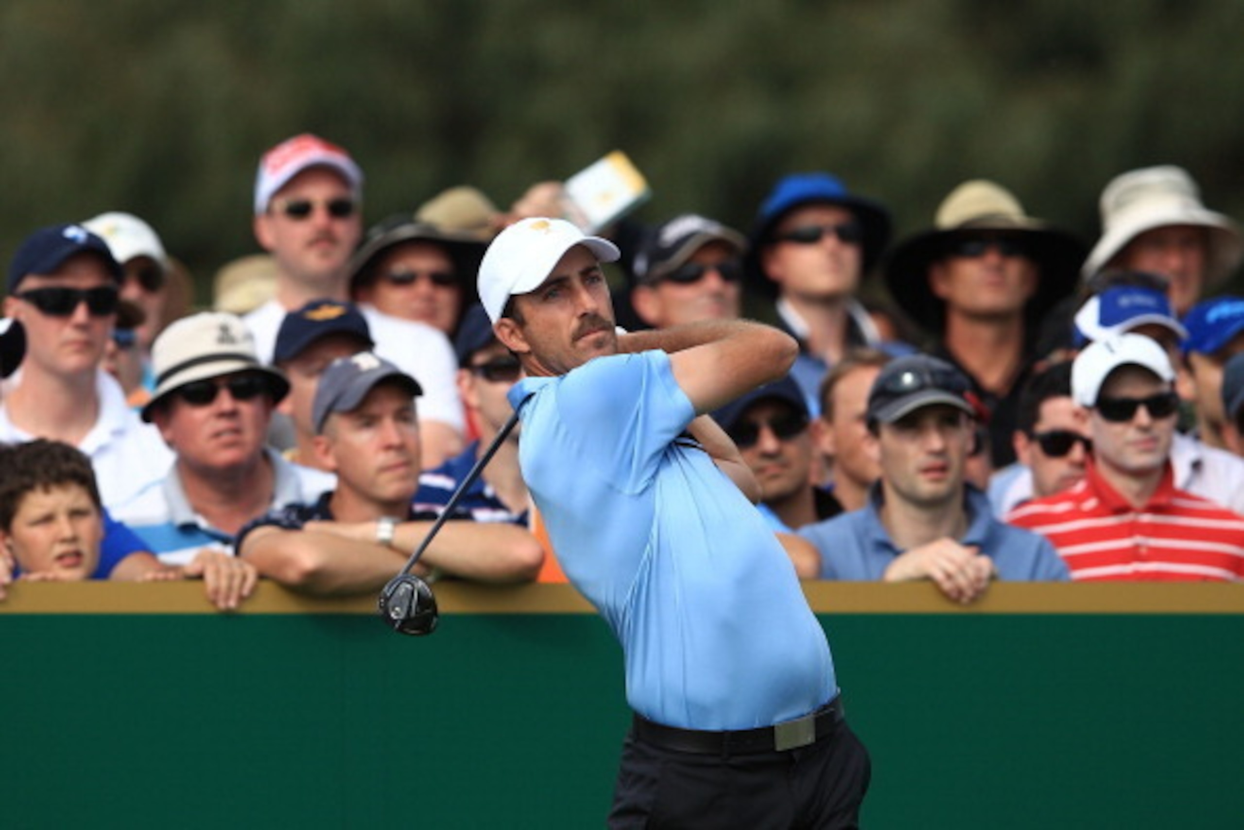 MELBOURNE, AUSTRALIA - NOVEMBER 17:  Geoff Ogilvy of the International Team plays the tee shot on the 18th hole during the Day One Foursome Matches of the 2011 Presidents Cup at Royal Melbourne Golf Course on November 17, 2011 in Melbourne, Australia.  (P