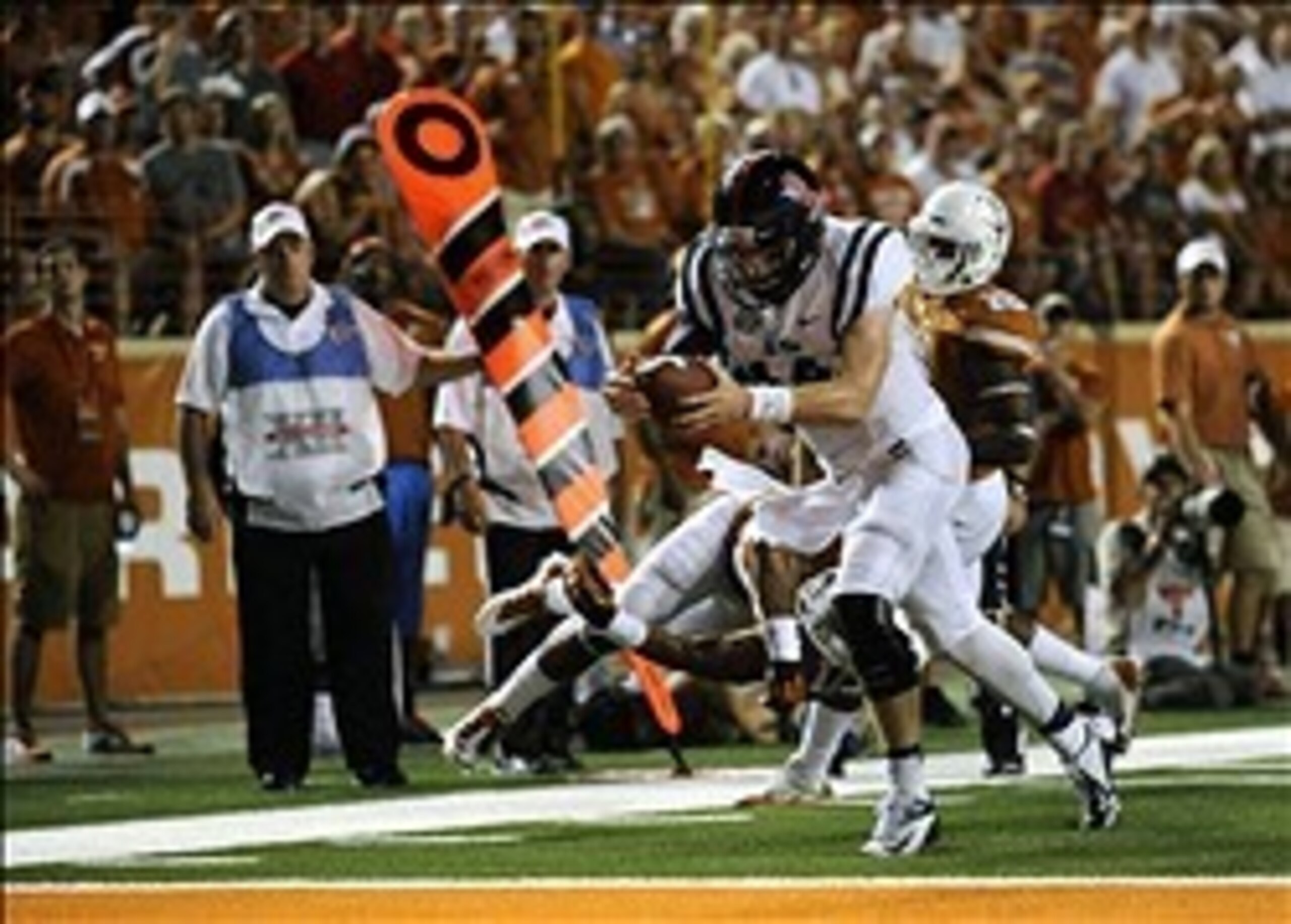 Sep 14, 2013; Austin, TX, USA; Mississippi Rebels quarterback Bo Wallace (14) runs for a touchdown against the Texas Longhorns during the second half at Darrell K Royal-Texas Memorial Stadium. Ole Miss beat Texas 44-23. Mandatory Credit: Brendan Maloney-U