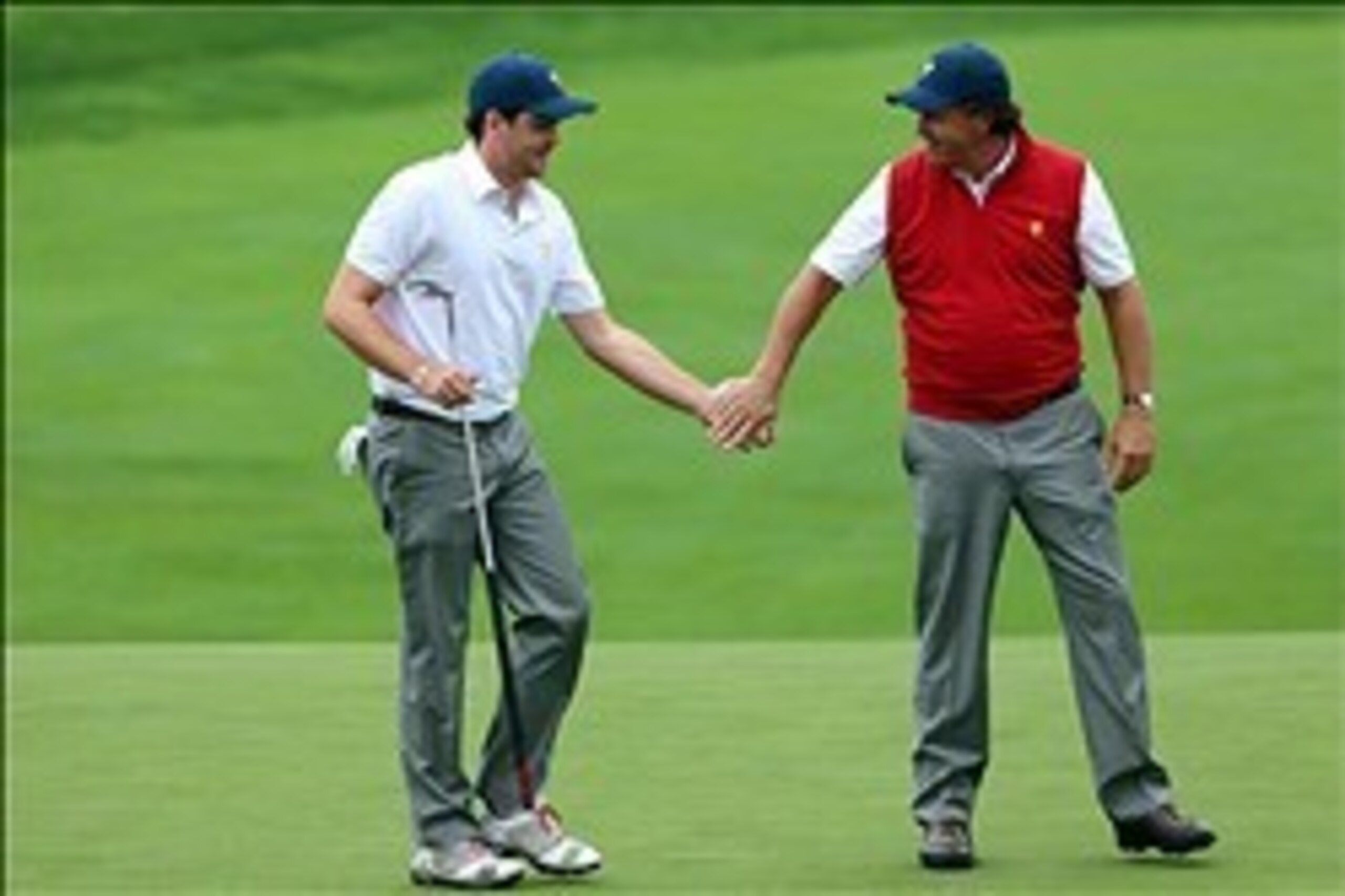 Oct 6, 2013; Dublin, OH, USA; Keegan Bradley and Phil Mickelson celebrate after halving their match during the third round of the Presidents Cup at Muirfield Village Golf Club. Mandatory Credit: Allan Henry-USA TODAY Sports Oct 6, 2013; Dublin, OH, USA; Keegan Bradley and Phil Mickelson celebrate after halving their match during the third round of the Presidents Cup at Muirfield Village Golf Club. Mandatory Credit: Allan Henry-USA TODAY Sports