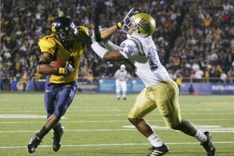 BERKELEY, CA - NOVEMBER 04:  Wide receiver DeSean Jackson #1 of the California Golden Bears stiff arms  Trey Brown #23 of the UCLA Bruins in the second half at Memorial Stadium during the game on November 4, 2006 in Berkeley, California. Cal defeated UCLA