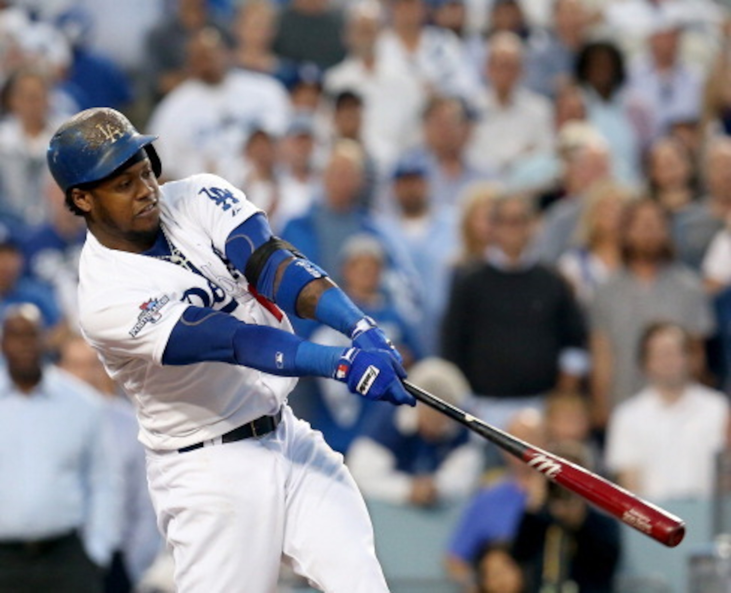 LOS ANGELES, CA - OCTOBER 14:  Hanley Ramirez #13 of the Los Angeles Dodgers flies out to right field as Mark Ellis #14 advances to third base in the fourth inning against the St. Louis Cardinals in Game Three of the National League Championship Series at