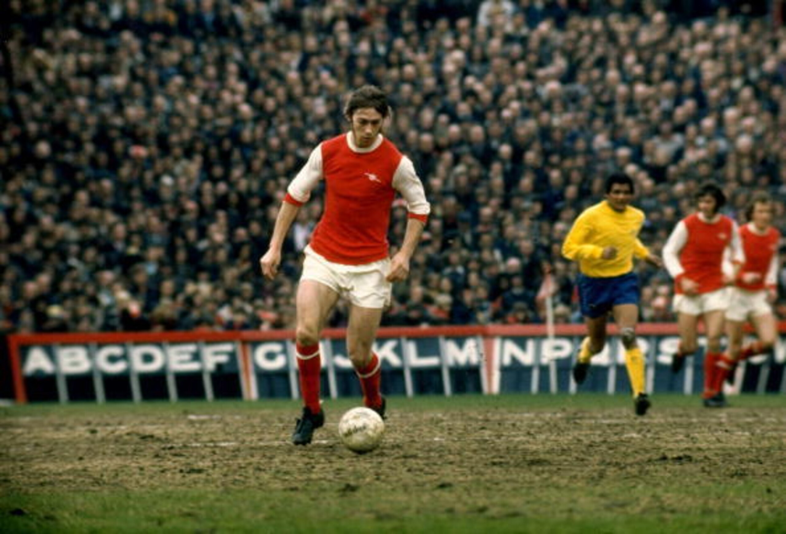 1975:  Charlie George of Arsenal in action during a Division One match played at Highbury in London, England. \ Mandatory Credit: Allsport UK /Allsport