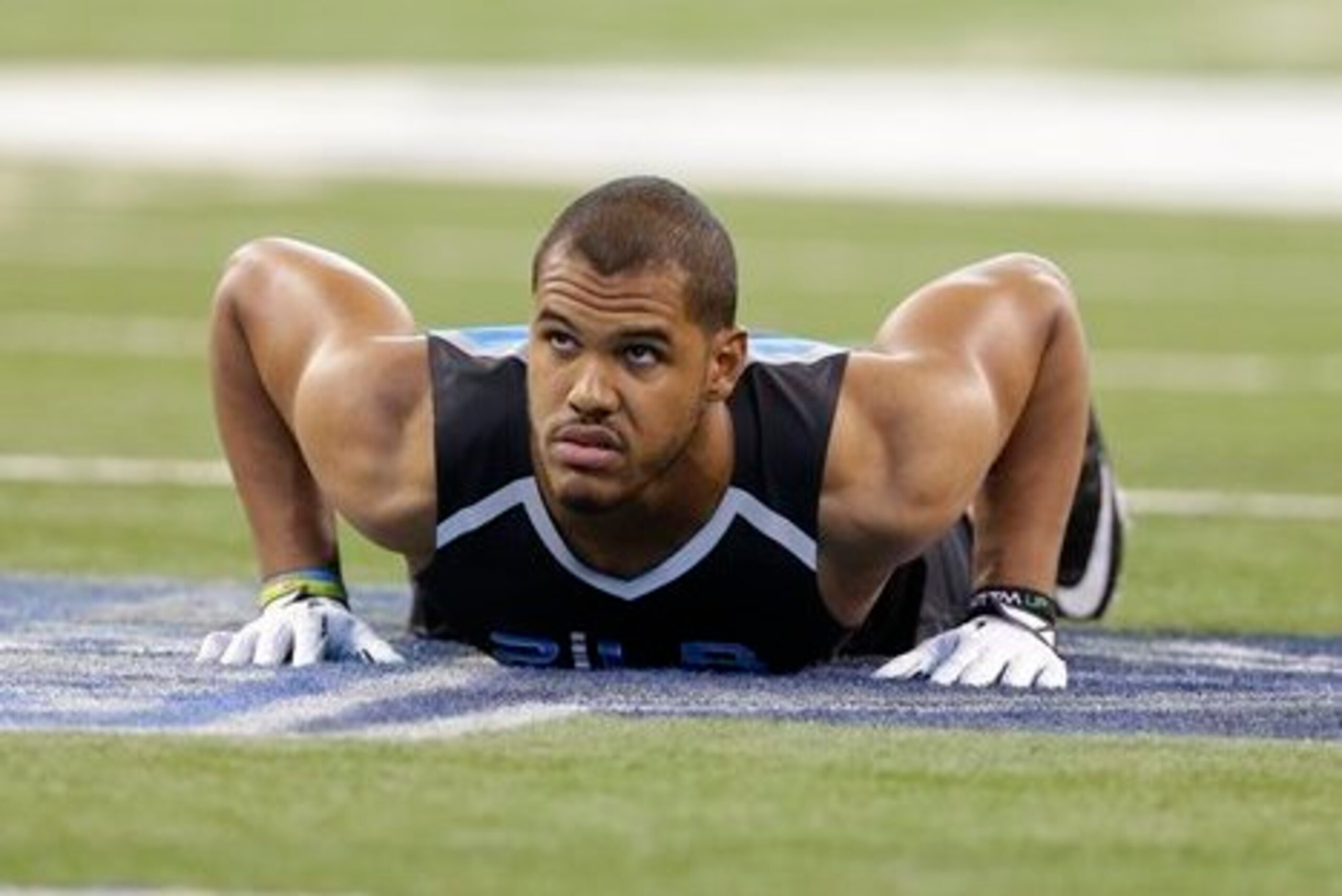 UCLA linebacker Anthony Barr runs a drill at the NFL football scouting combine in Indianapolis, Monday, Feb. 24, 2014. (AP Photo/Michael Conroy)