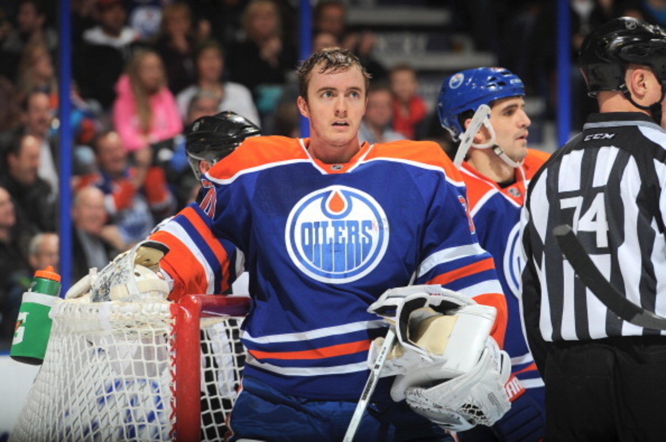 EDMONTON, AB - JANUARY 29: Ben Scrivens #30 of the Edmonton Oilers removes his mask between play in a game against the San Jose Sharks on January 29, 2014 at Rexall Place in Edmonton, Alberta, Canada. (Photo by Andy Devlin/NHLI via Getty Images)