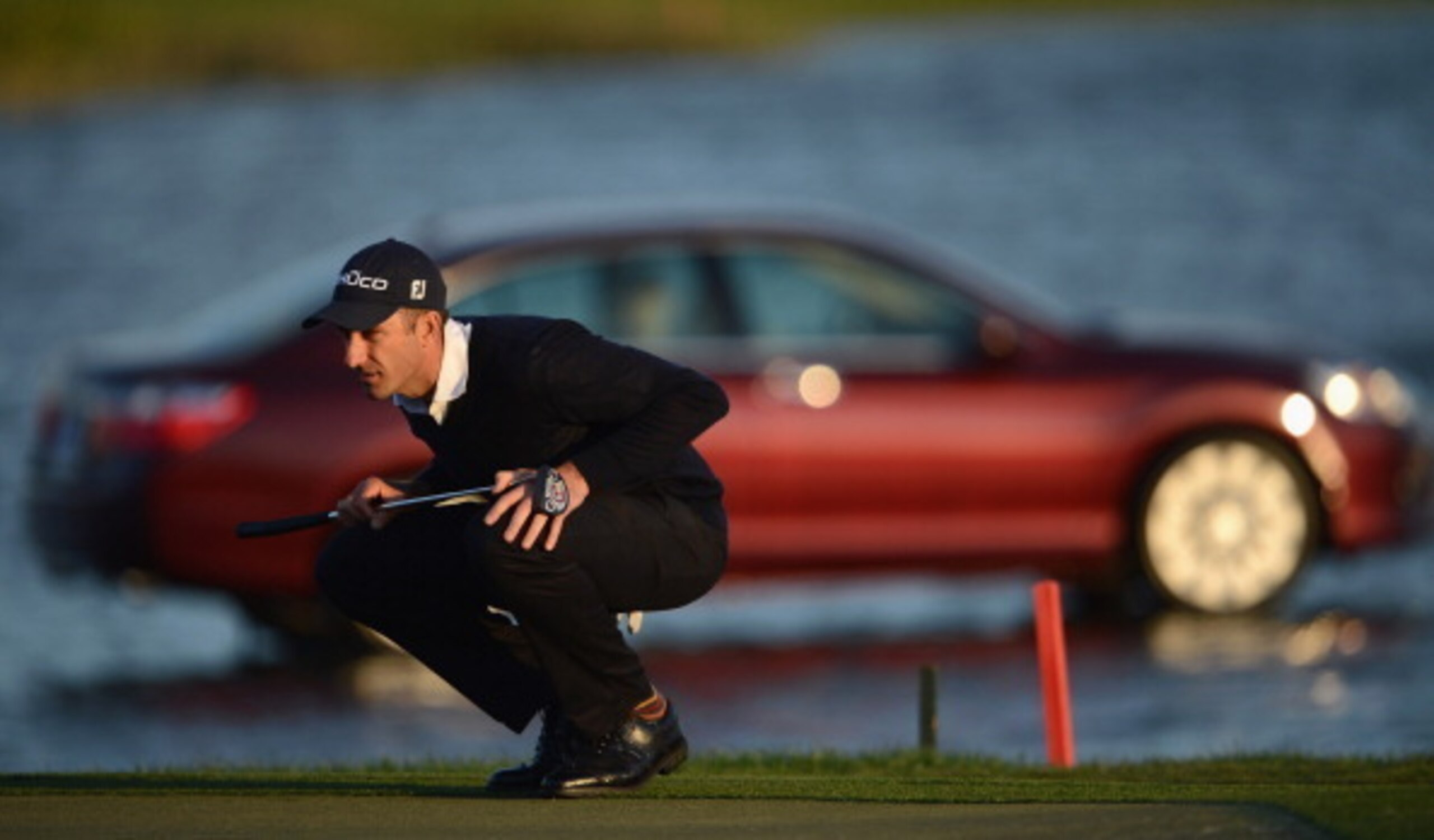 Geoff Ogilvy stares down a putt in the final round of the 2013 Honda Classic.