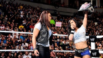 Despite being disqualified, AJ Lee remains the Divas Champion.