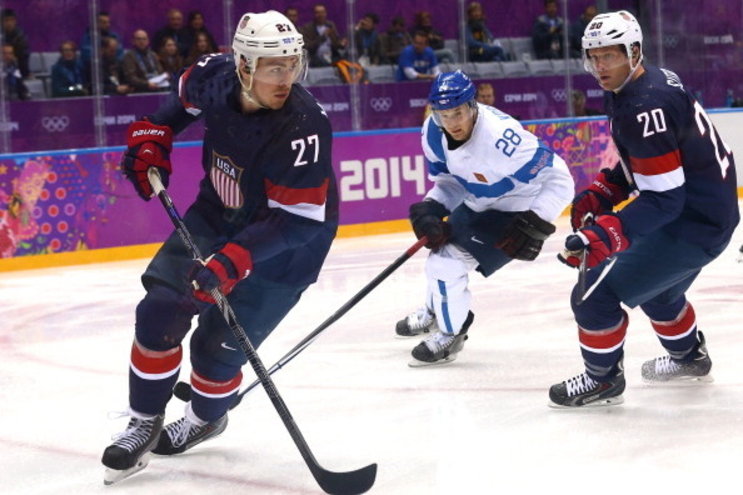 SOCHI, RUSSIA - FEBRUARY 22: Ryan McDonagh #27 of the United States handles the puck against Lauri Korpikoski #28 of Finland in the first period during the Men's Ice Hockey Bronze Medal Game on Day 15 of the 2014 Sochi Winter Olympics at Bolshoy Ice Dome 