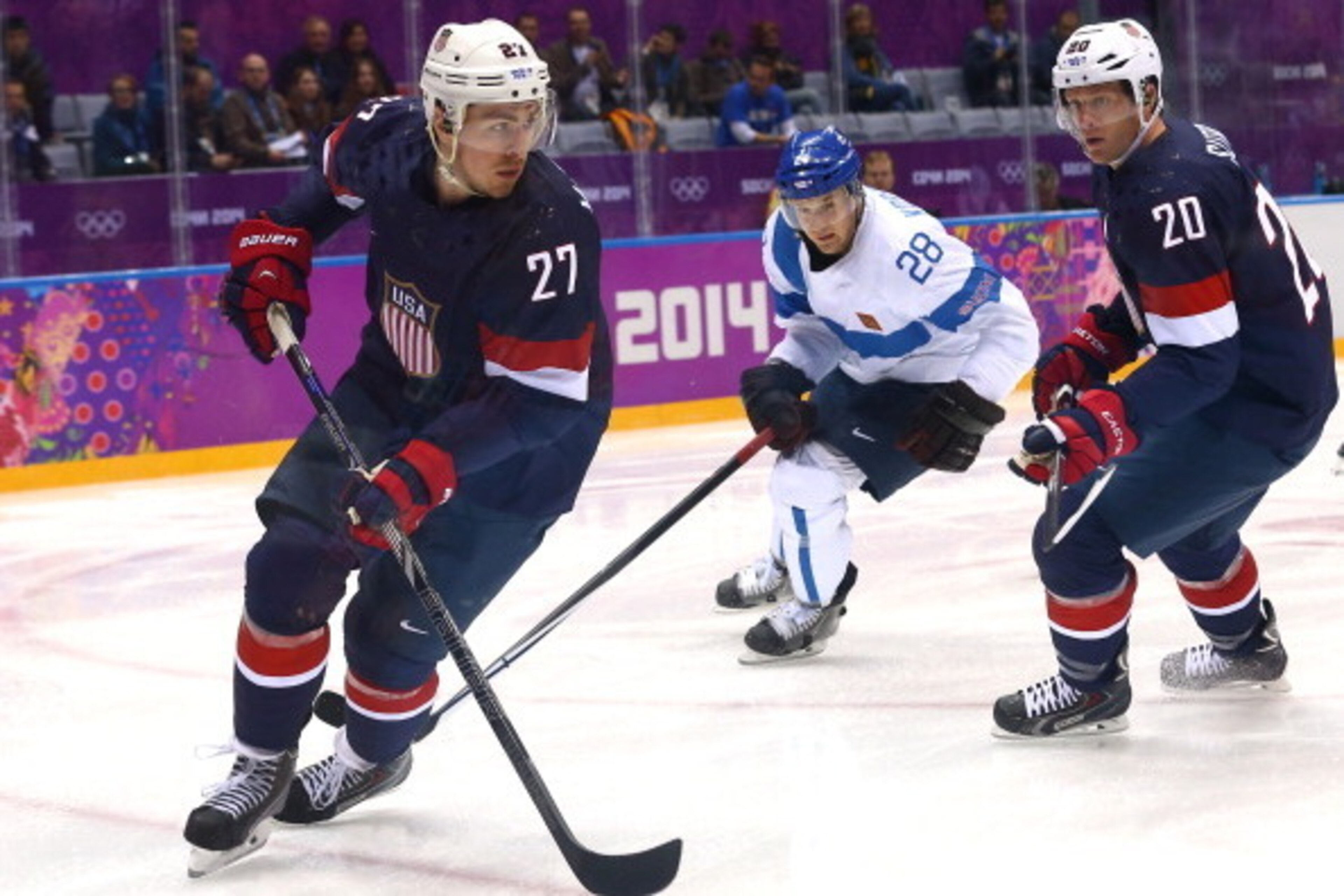 SOCHI, RUSSIA - FEBRUARY 22: Ryan McDonagh #27 of the United States handles the puck against Lauri Korpikoski #28 of Finland in the first period during the Men's Ice Hockey Bronze Medal Game on Day 15 of the 2014 Sochi Winter Olympics at Bolshoy Ice Dome 