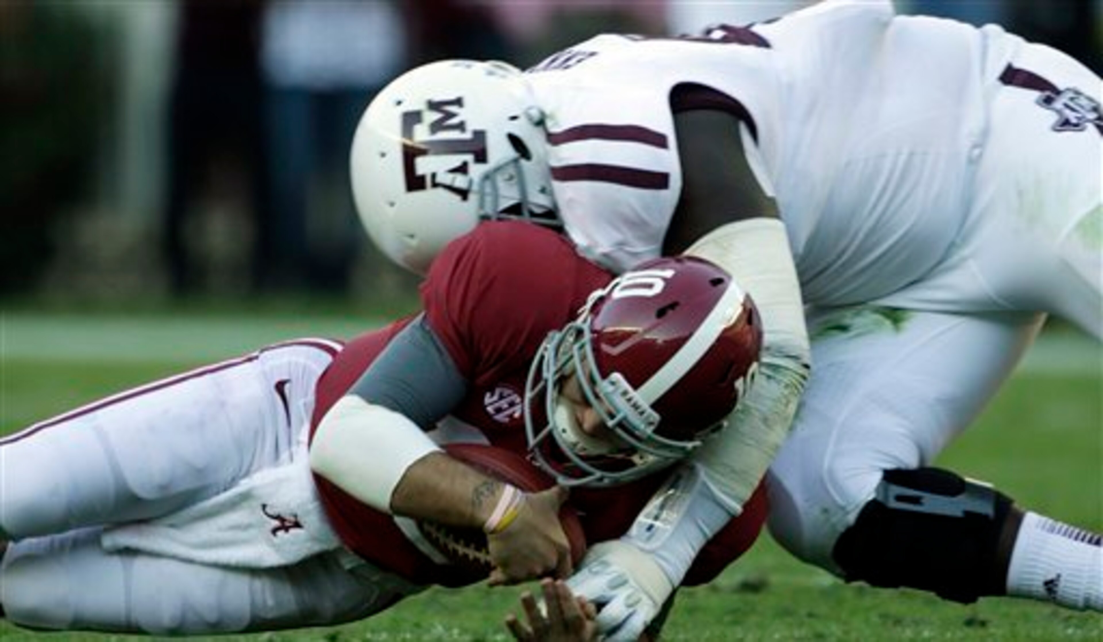 Aggie DT Kirby Ennis tackles AJ McCarron Aggie DT Kirby Ennis tackles AJ McCarron