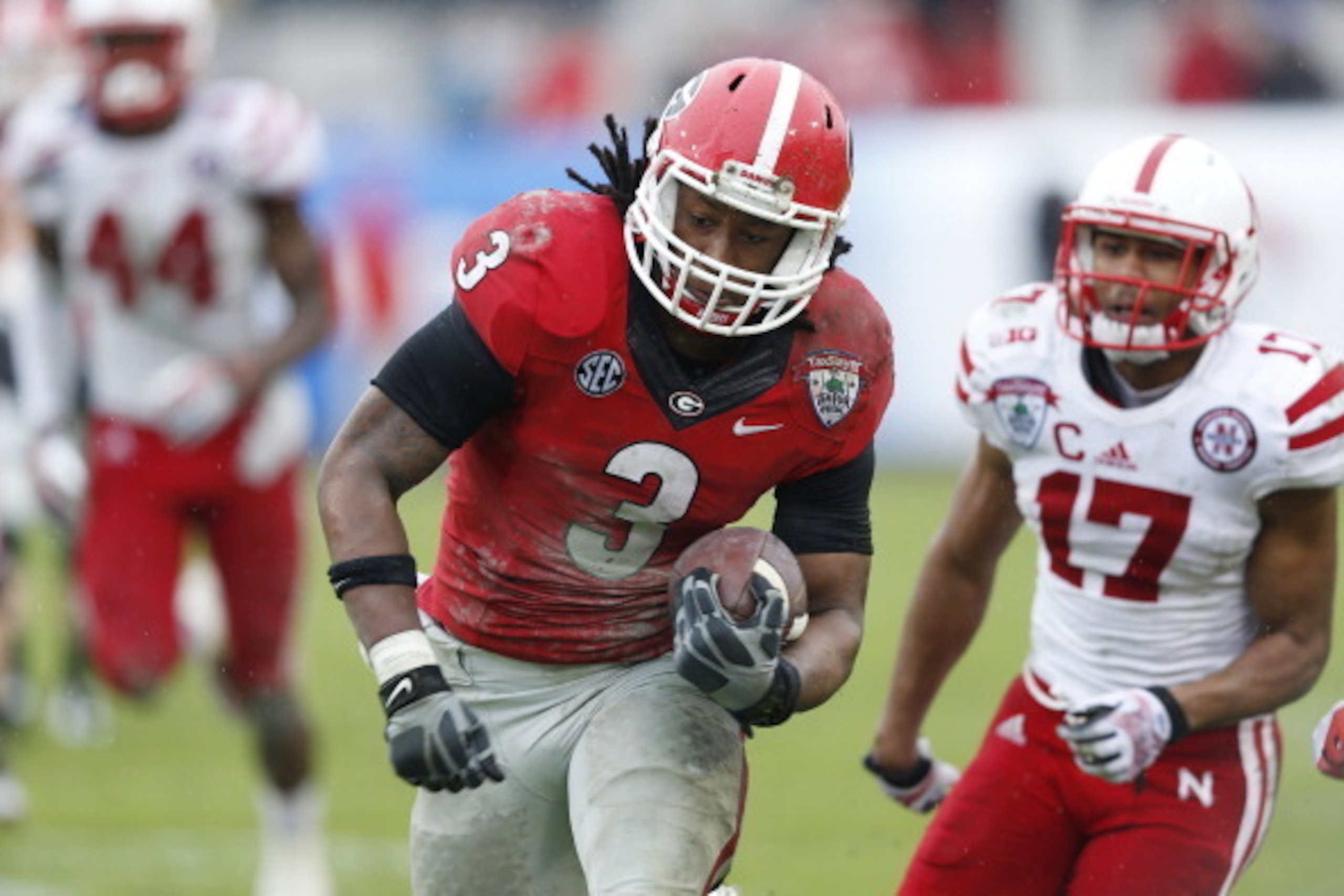 JACKSONVILLE, FL - JANUARY 1: Todd Gurley #3 of the Georgia Bulldogs runs downfield on a 30-yard pass play to set up a field goal in the second half against the Nebraska Cornhuskers during the TaxSlayer.com Gator Bowl at Everbank Field on January 1, 2014 
