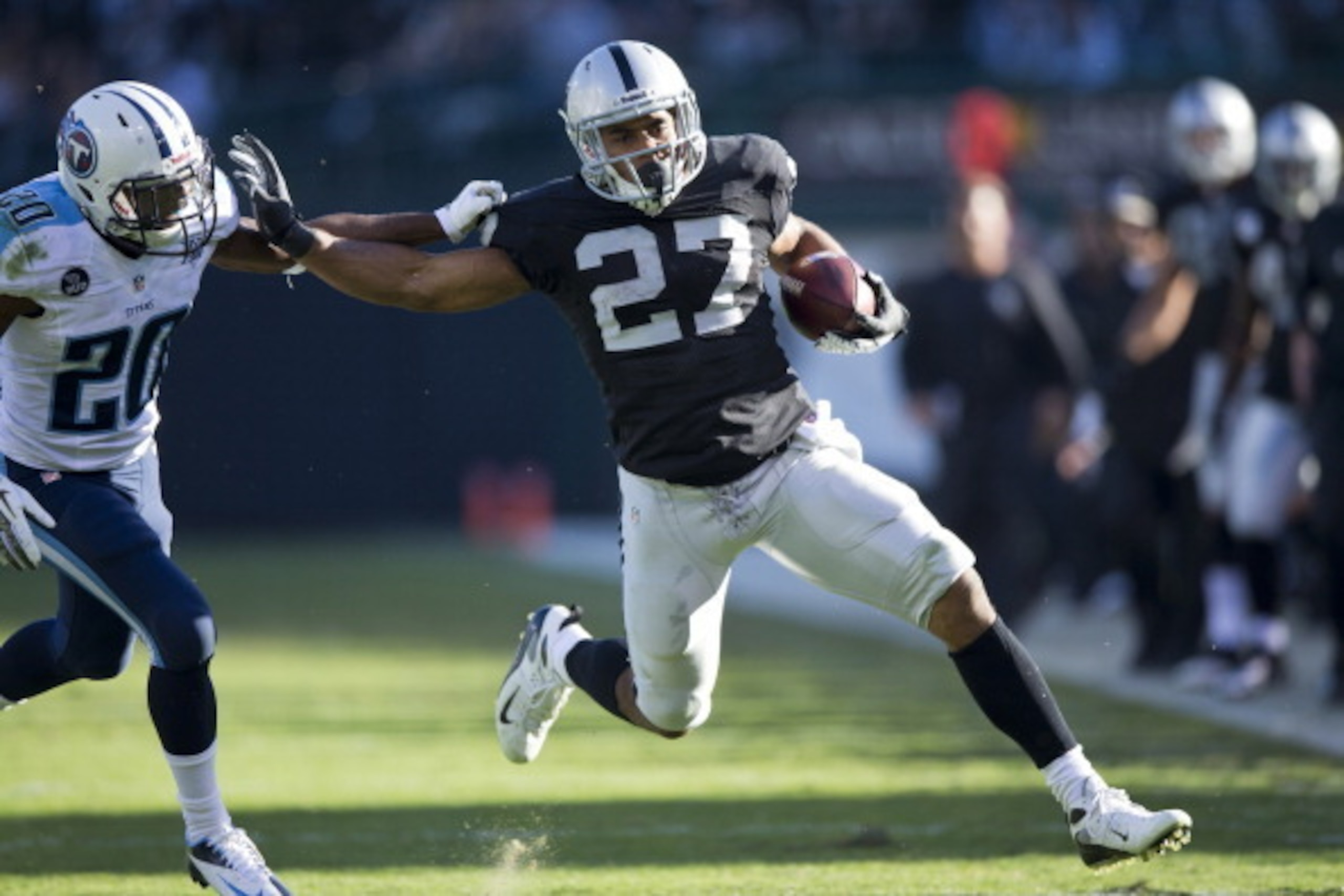 OAKLAND, CA - NOVEMBER 24: Rashad Jennings #27 of the Oakland Raiders rushes past Alterraun Verner #20 of the Tennessee Titans during the second quarter at O.co Coliseum on November 24, 2013 in Oakland, California. (Photo by Jason O. Watson/Getty Images) OAKLAND, CA - NOVEMBER 24: Rashad Jennings #27 of the Oakland Raiders rushes past Alterraun Verner #20 of the Tennessee Titans during the second quarter at O.co Coliseum on November 24, 2013 in Oakland, California. (Photo by Jason O. Watson/Getty Images)