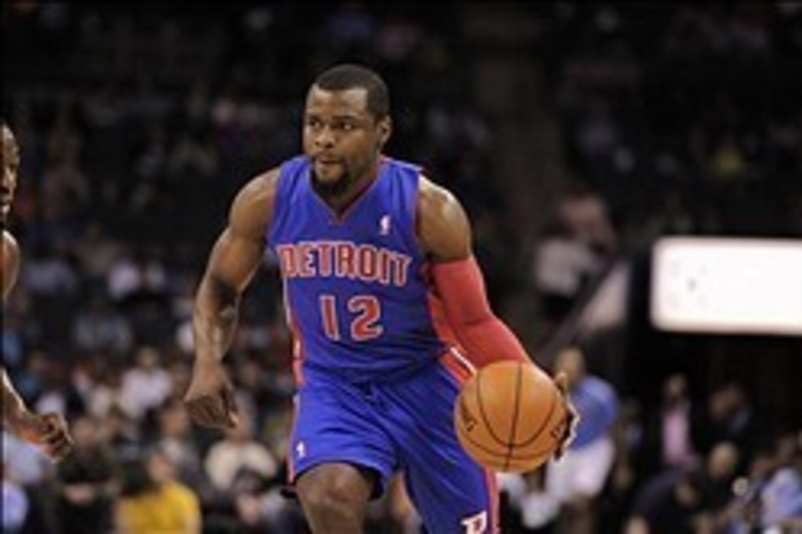 Feb 19, 2014; Charlotte, NC, USA; Detroit Pistons guard Will Bynum (12) drives down the court during the first half of the game against the Charlotte Bobcats at Time Warner Cable Arena. Mandatory Credit: Sam Sharpe-USA TODAY Sports