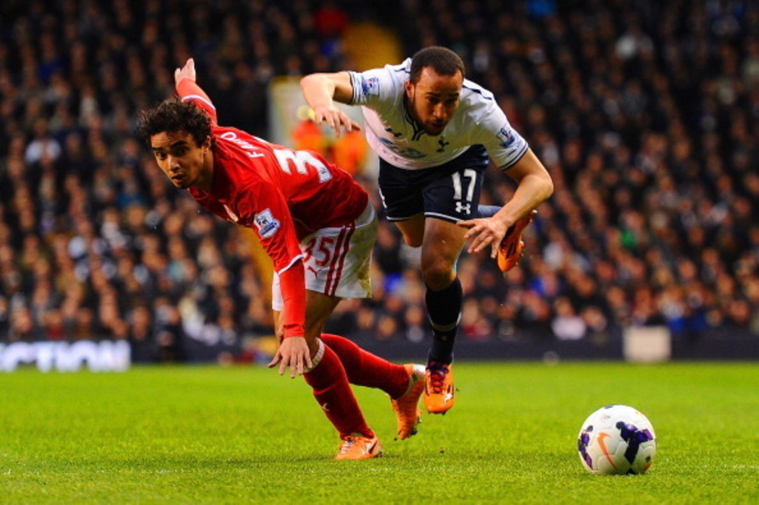 Andros Townsend battles it out with Cardiff right-back Fabio.