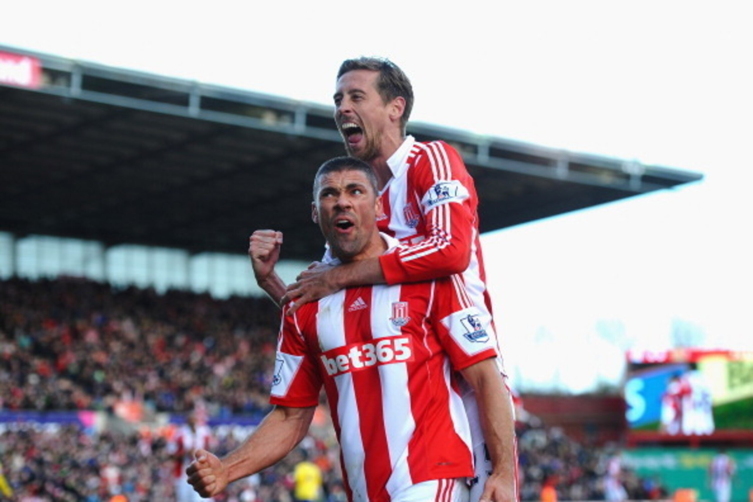 STOKE ON TRENT, ENGLAND - MARCH 01: Jonathan Walters of Stoke City celebrates his goal with Peter Crouch during the Barclays Premier League match between Stoke City and Arsenal at Britannia Stadium on March 1, 2014 in Stoke on Trent, England.  (Photo by L