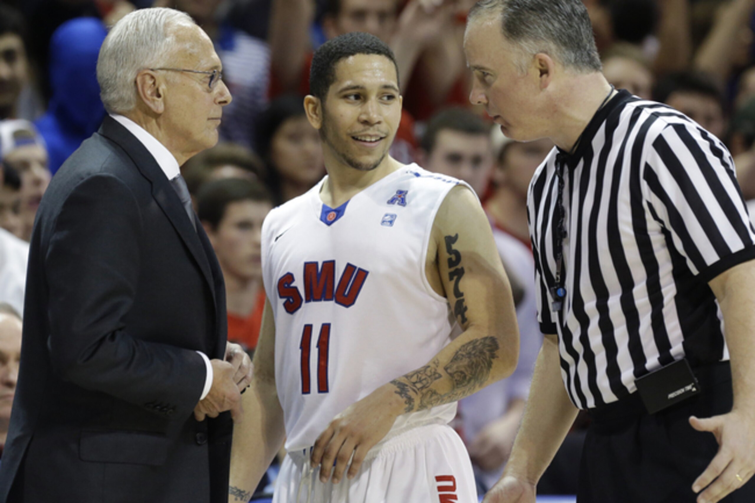 SMU's Nic Moore with head coach Larry Brown.