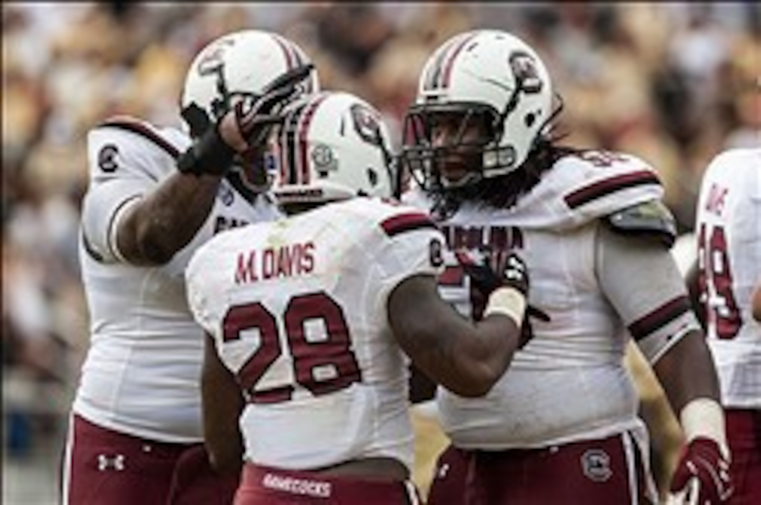 Blockers like guard A.J. Cann (far right) helped open plenty of holes for Gamecock tailback Mike Davis (No. 28).