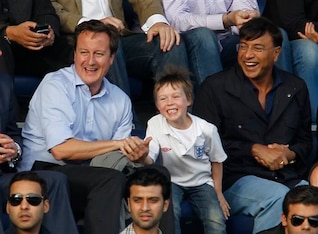Mittal pictured with David Cameron and his son