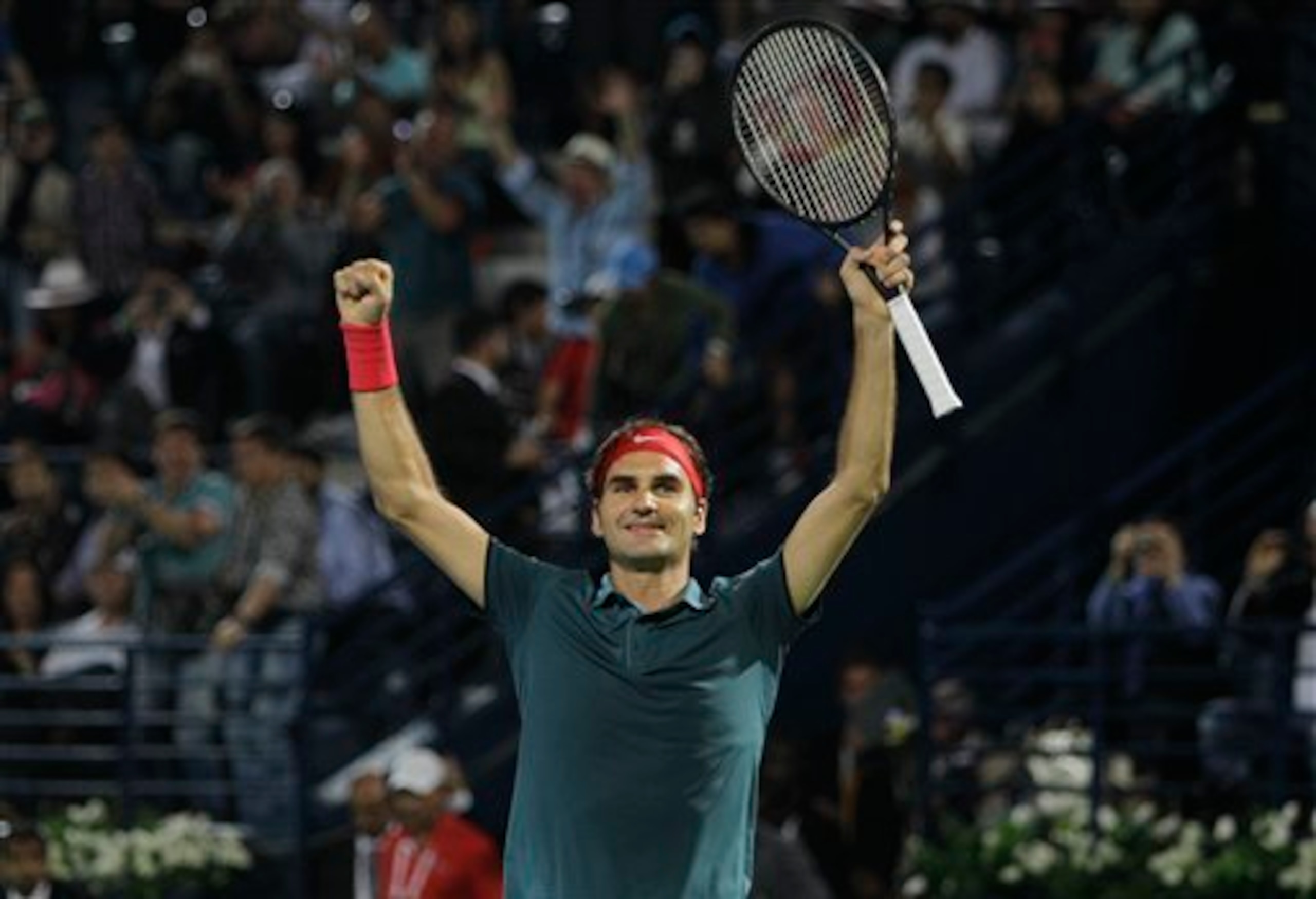 Roger Federer celebrates after winning in Dubai.