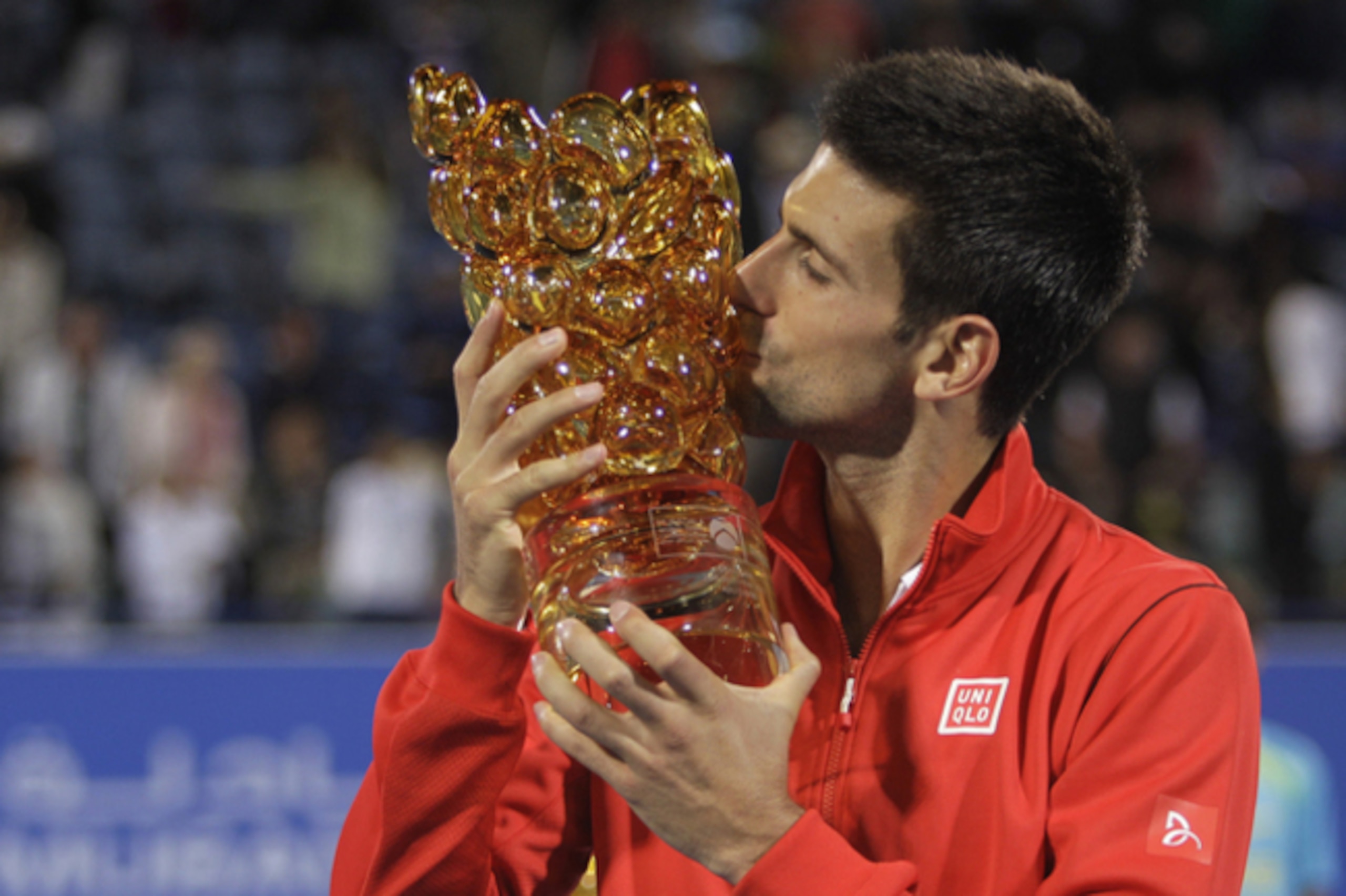 Novak Djokovic with the trophy from Mubadala exhibition. Novak Djokovic with the trophy from Mubadala exhibition.