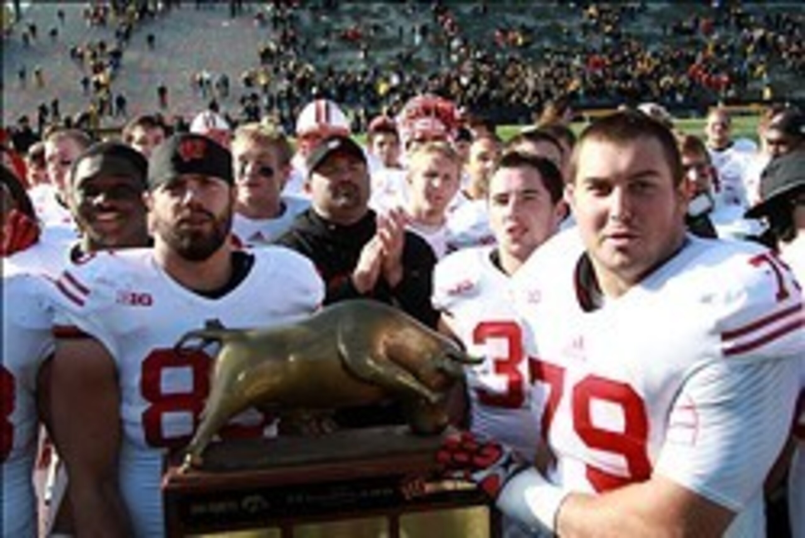 Nov 2, 2013; Iowa City, IA, USA; The Wisconsin Badgers sing their fight song and share the Heartland Trophy with fans after their win against the Iowa Hawkeyes at Kinnick Stadium.  Wisconsin beat Iowa 28-9.  Mandatory Credit: Reese Strickland-USA TODAY Sp