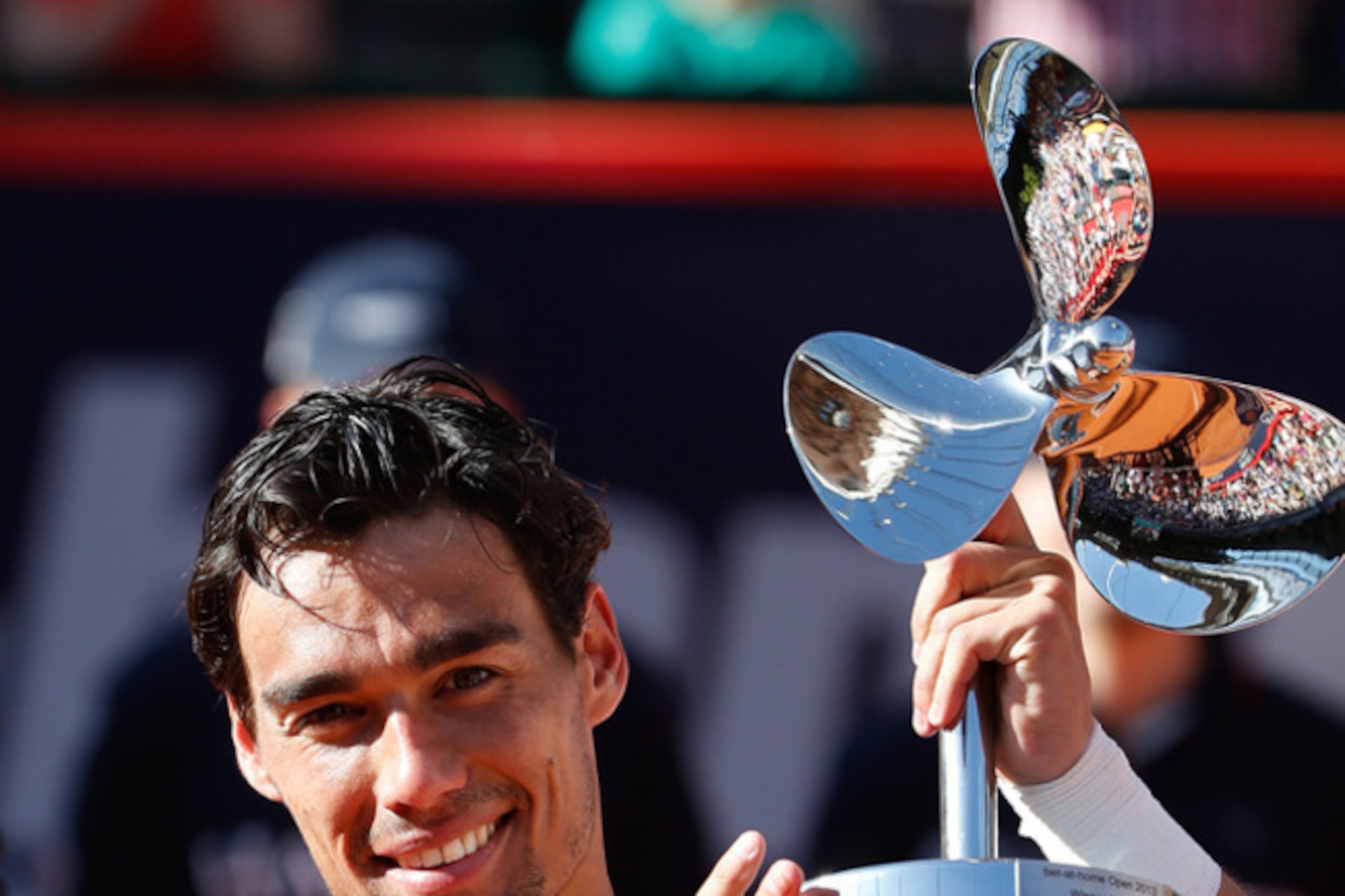 Fabio Fognini with the trophy from German Open Tennis Championships in 2013. Fabio Fognini with the trophy from German Open Tennis Championships in 2013.