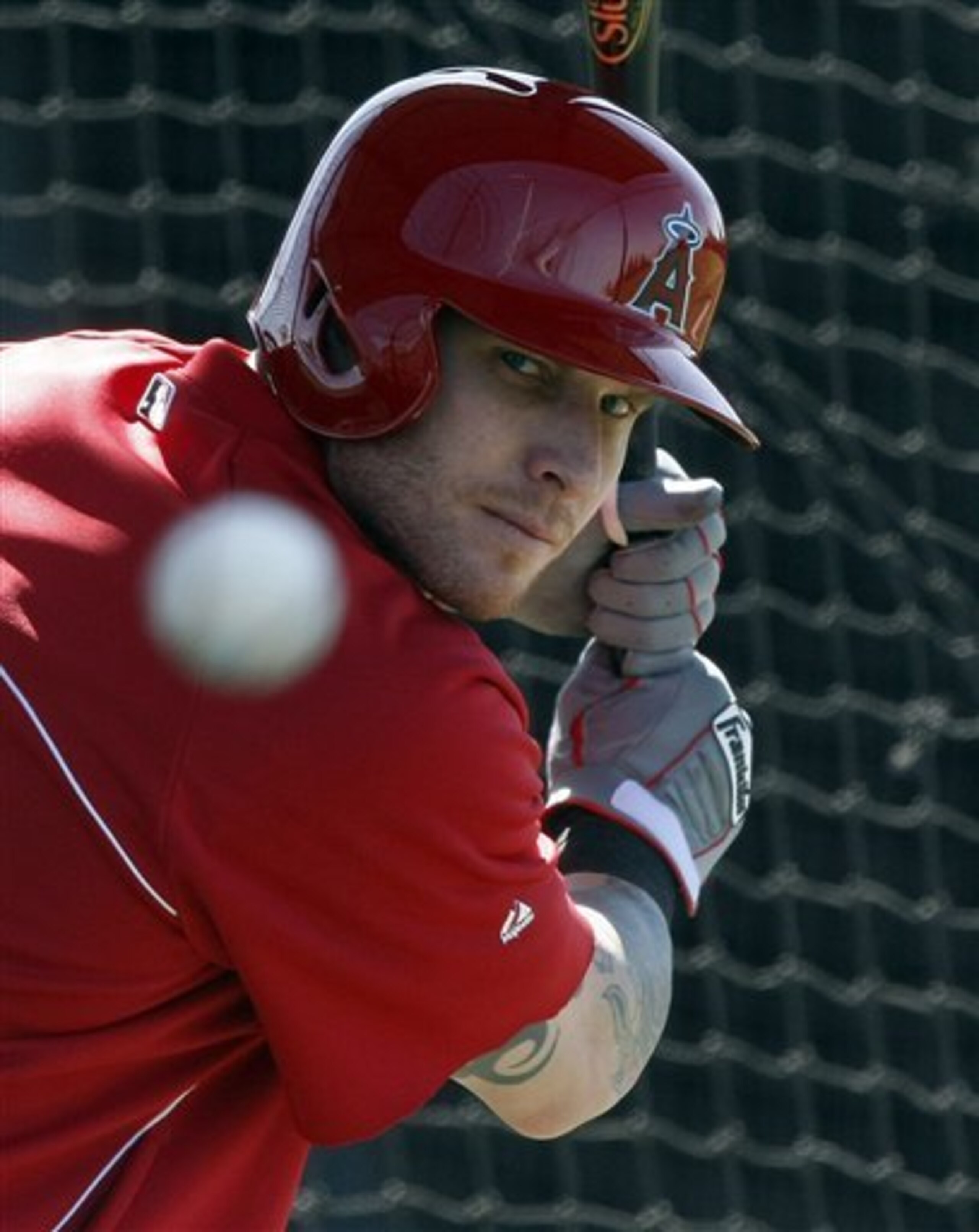 Los Angeles Angels left fielder Josh Hamilton (32)hits in the cage during spring training baseball practice, Thursday, Feb. 20, 2014, in Tempe, Ariz. (AP Photo/Rick Scuteri)