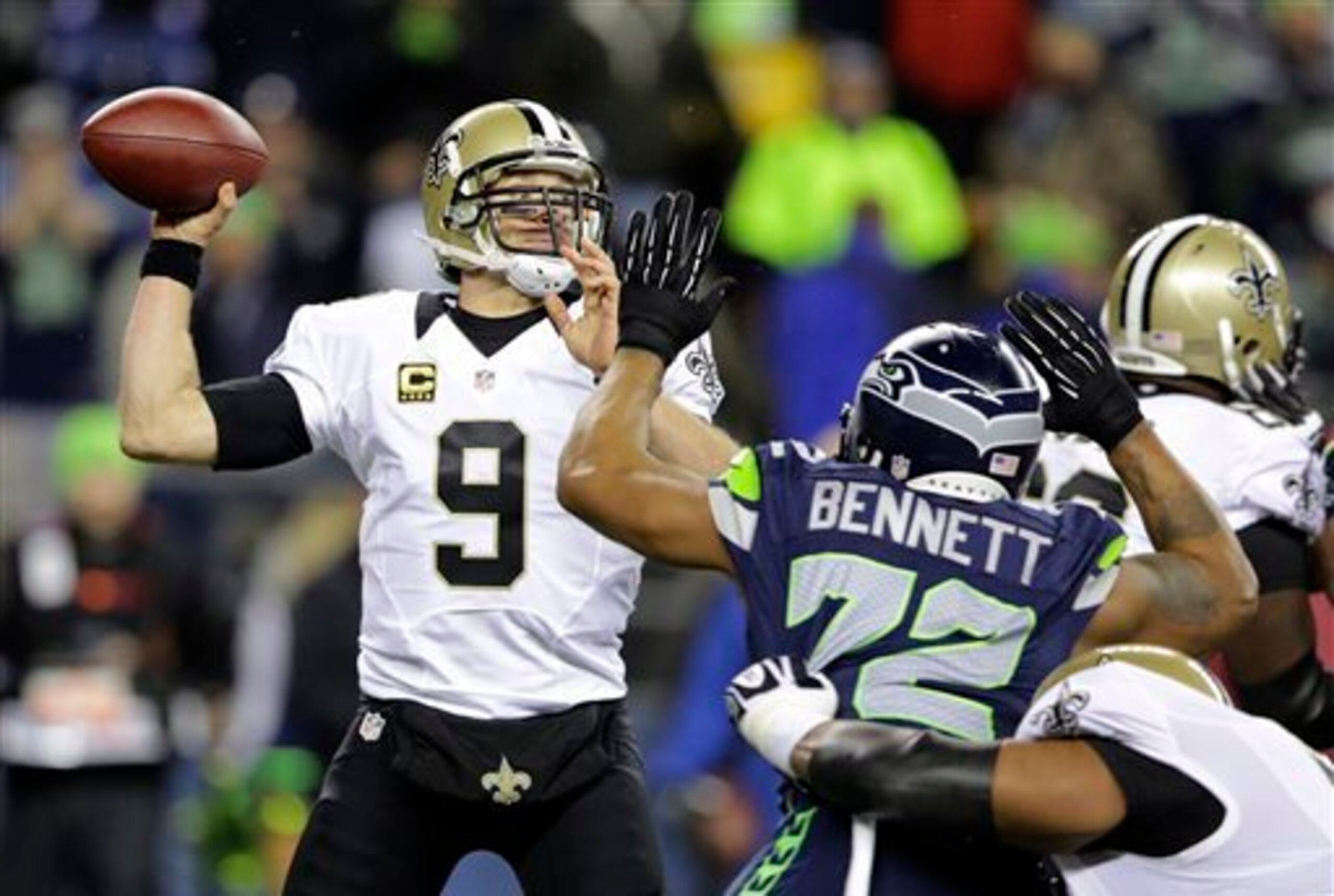 Michael Bennett puts pressure on Drew Brees